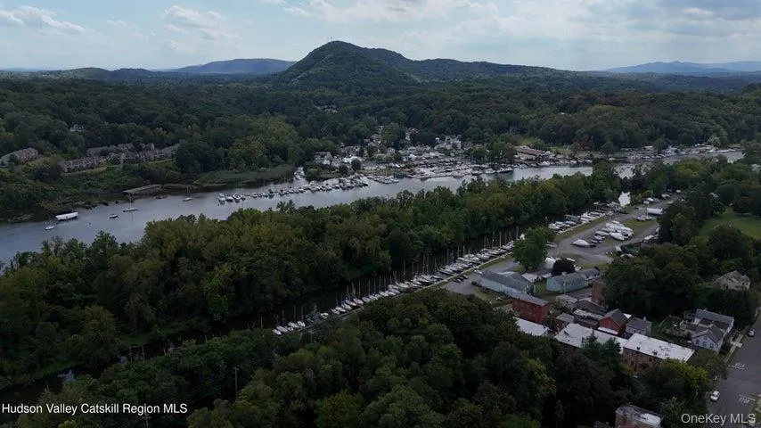 View of property location with a forest and a water and mountain view View of property location with a forest and a water and mountain view