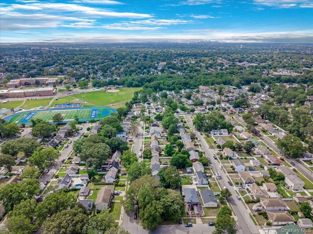 View of property location featuring nearby suburban area and a tree filled landscape View of property location featuring nearby suburban area and a tree filled landscape