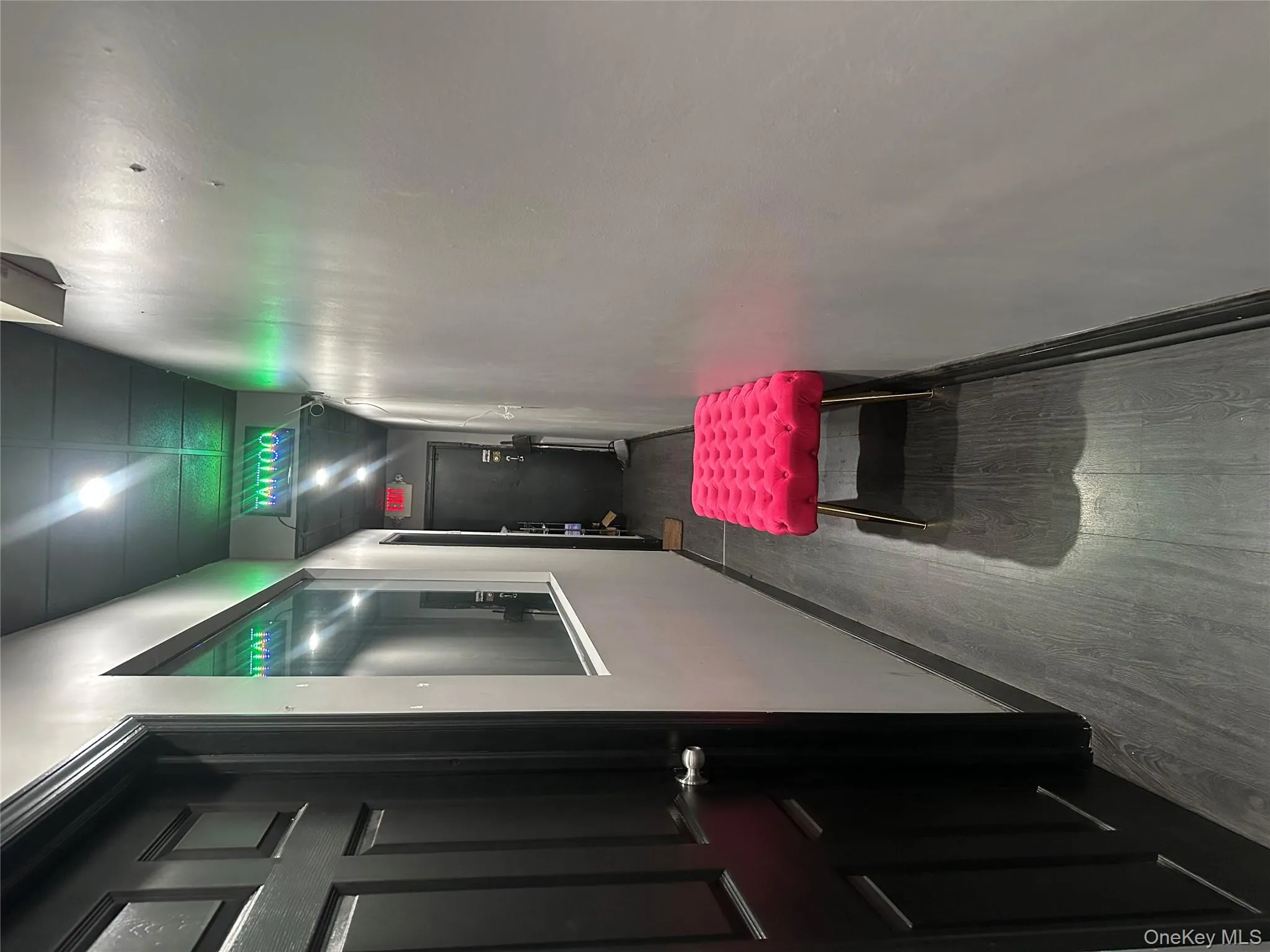 Hallway with dark wood-style floors and baseboards Hallway with dark wood-style floors and baseboards