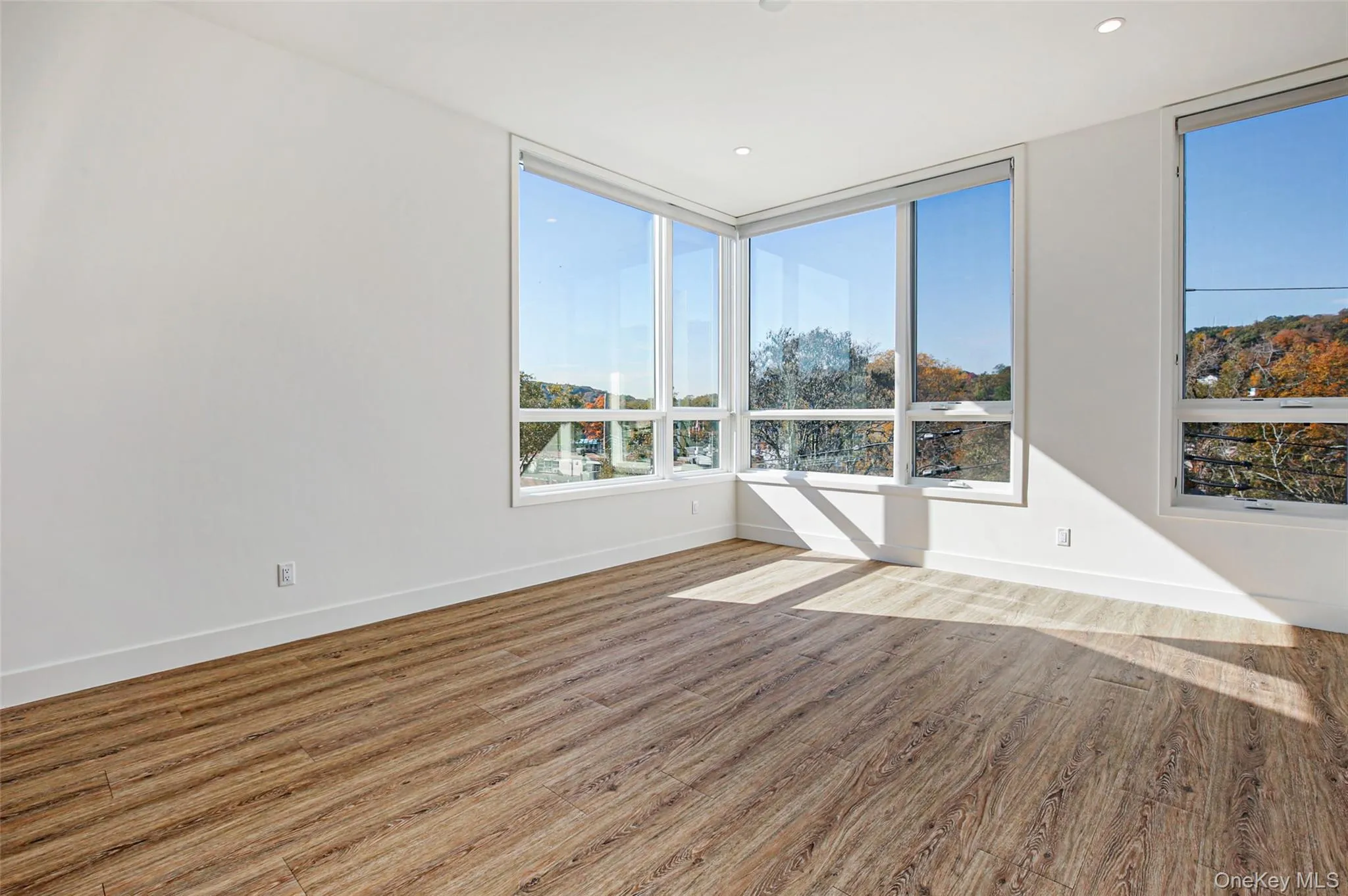 Spare room with hardwood / wood-style floors Spare room with hardwood / wood-style floors