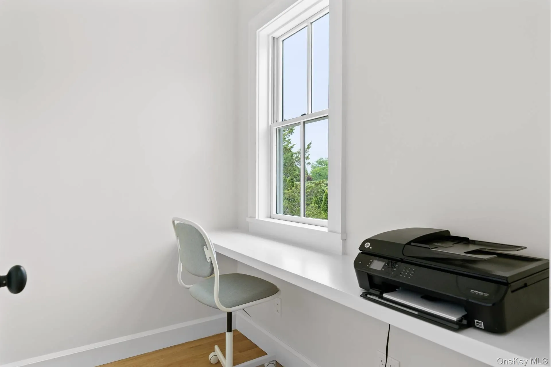 Home office with light wood-type flooring and baseboards Home office with light wood-type flooring and baseboards