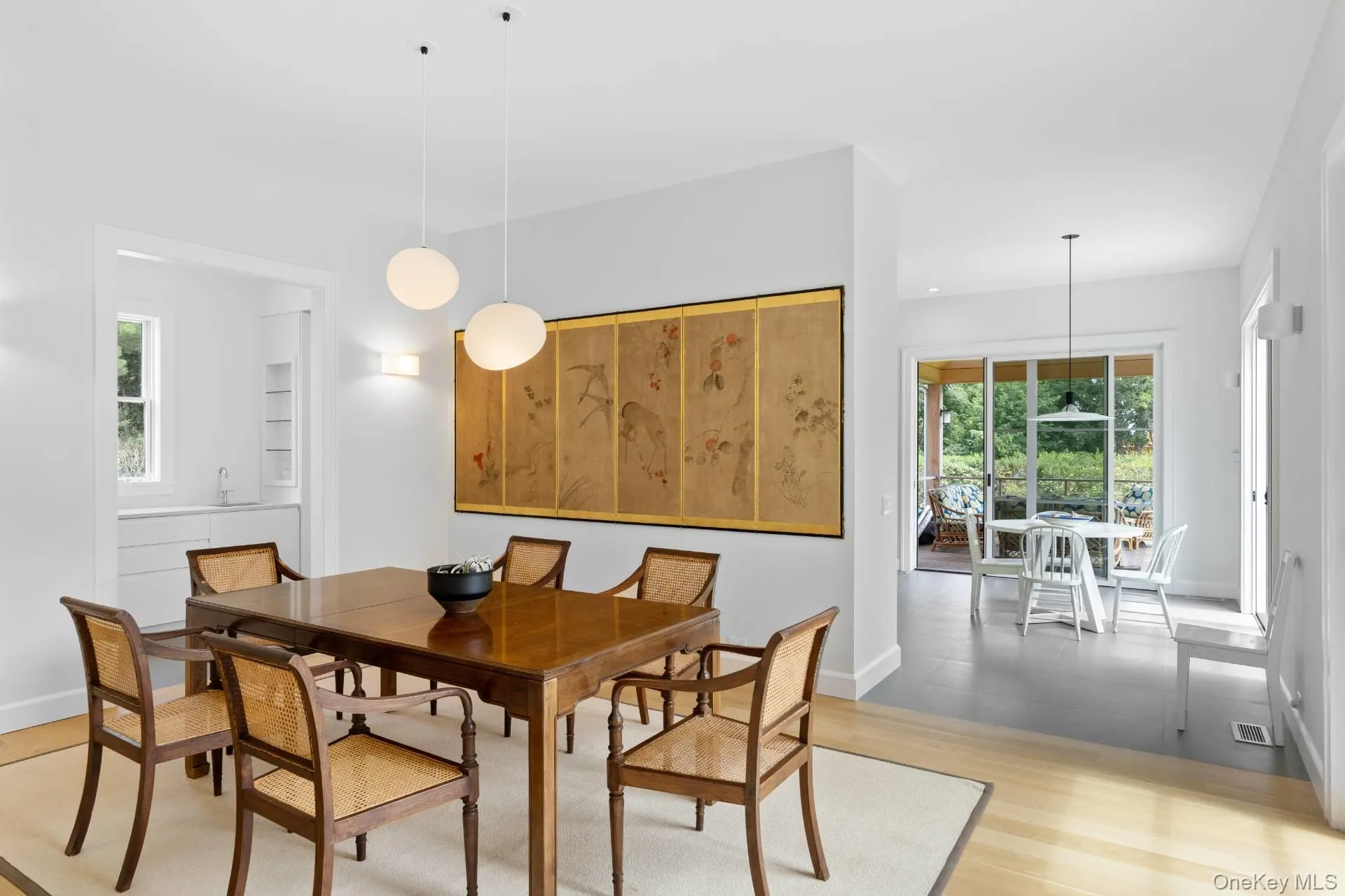 Dining room featuring light wood-type flooring and baseboards Dining room featuring light wood-type flooring and baseboards