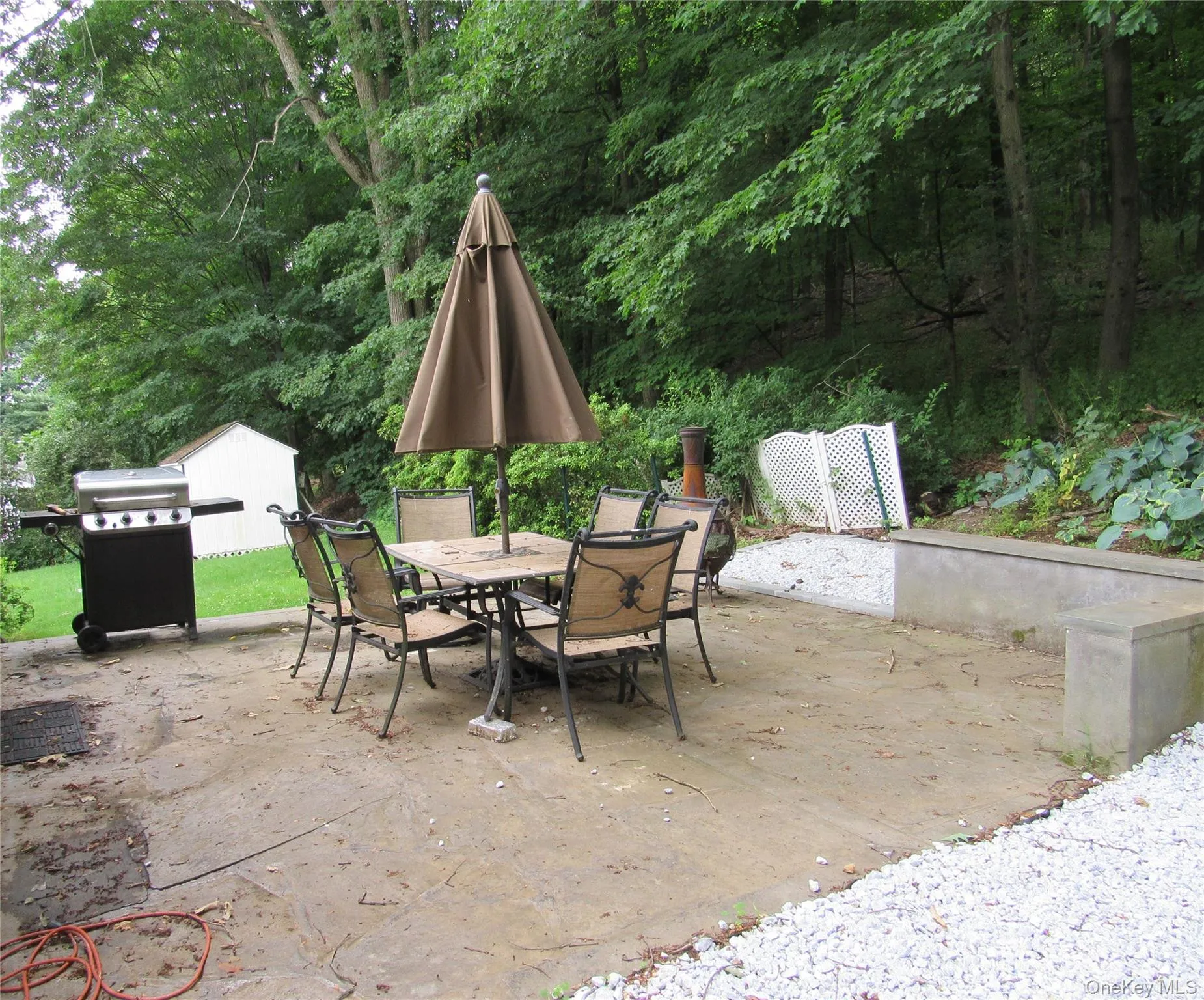 View of patio featuring outdoor dining area and grilling area View of patio featuring outdoor dining area and grilling area