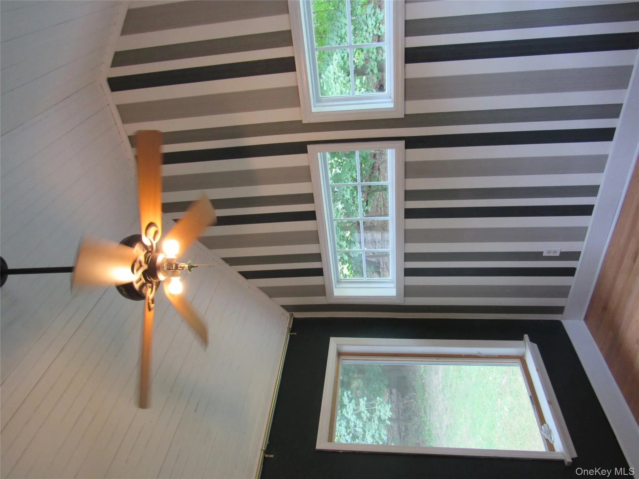 Pffice/Den with wood finished floors, wallpapered walls, a ceiling fan, and wooden ceiling Pffice/Den with wood finished floors, wallpapered walls, a ceiling fan, and wooden ceiling