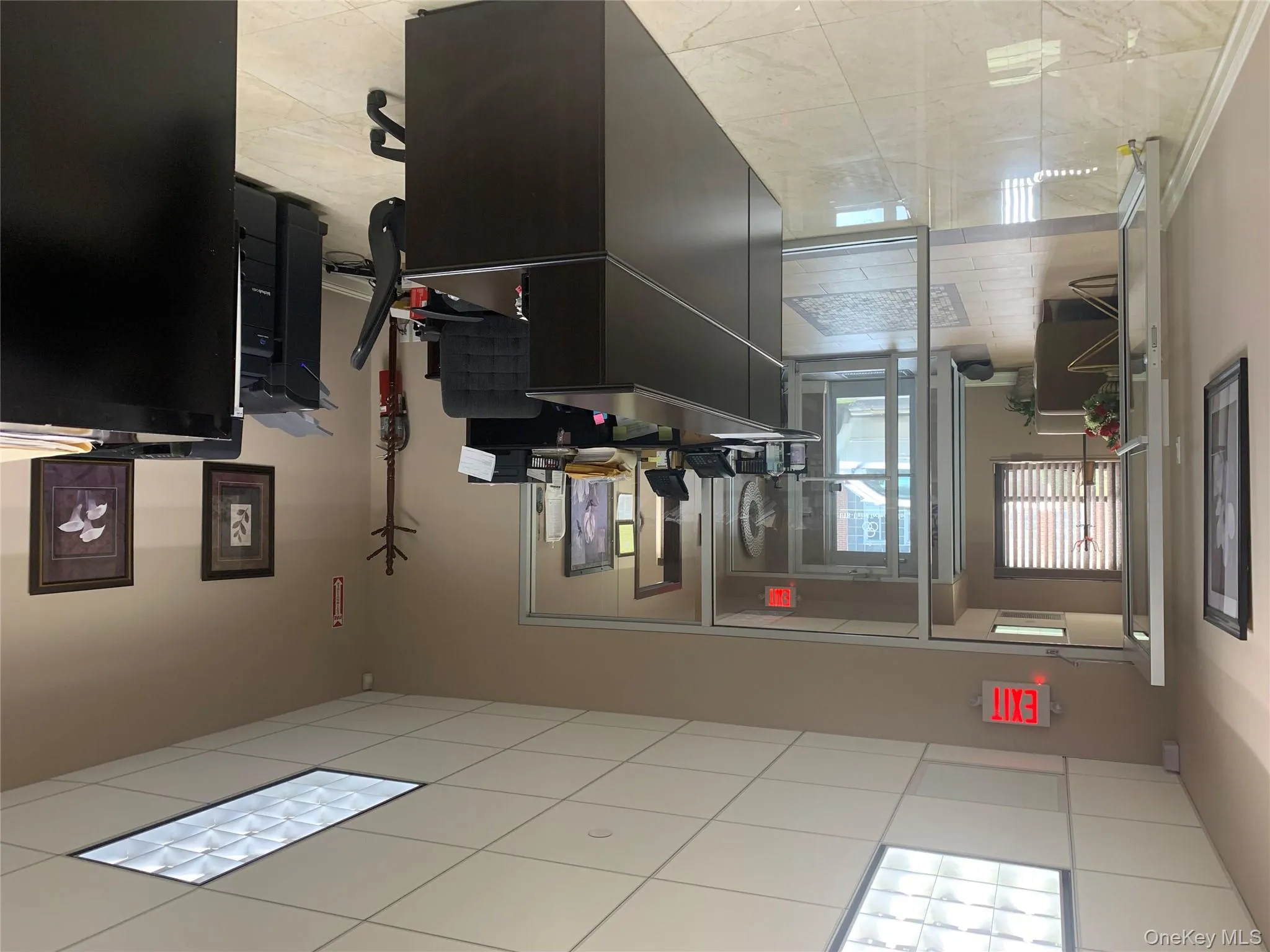 Office with a paneled ceiling Office with a paneled ceiling