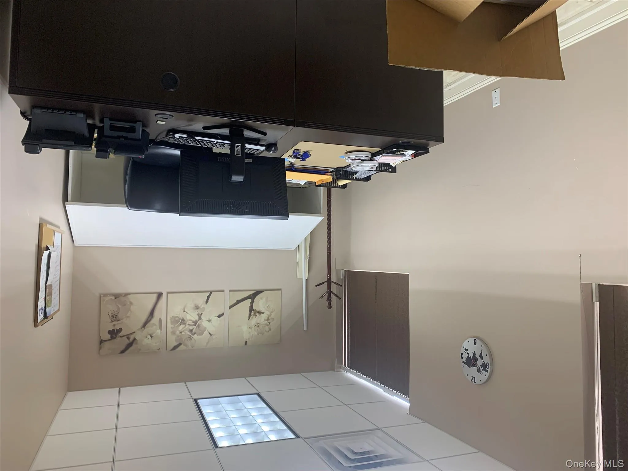 Office with a paneled ceiling Office with a paneled ceiling