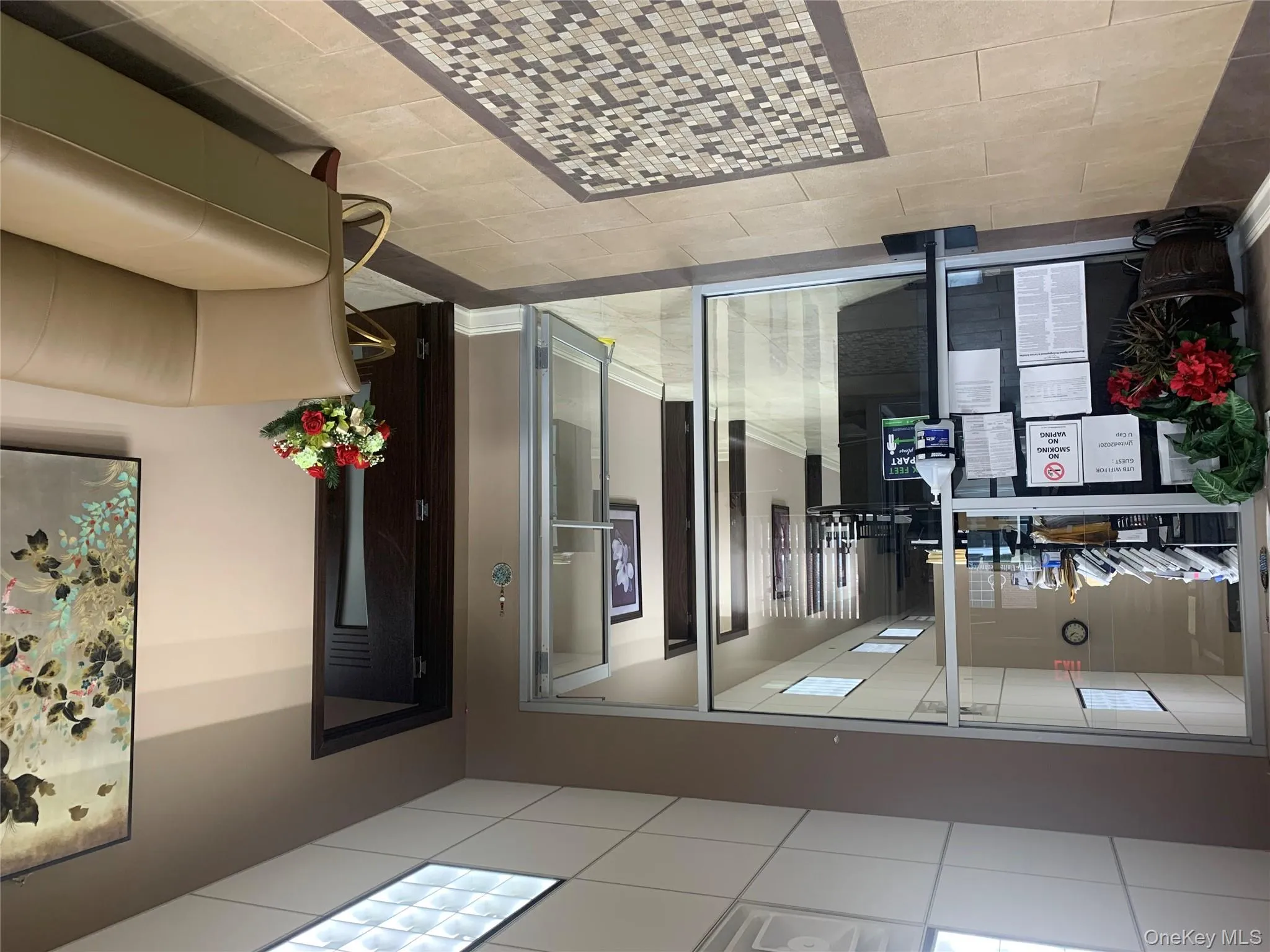 Common area featuring a paneled ceiling Common area featuring a paneled ceiling