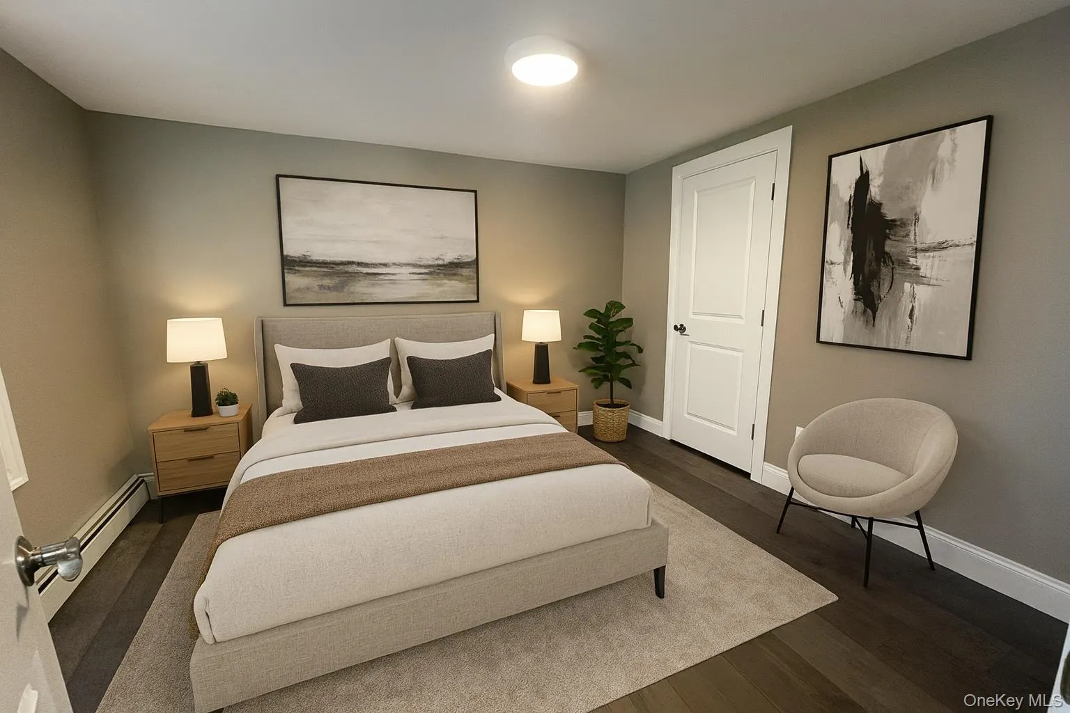 Bedroom with dark wood-style floors and a baseboard heating unit Bedroom with dark wood-style floors and a baseboard heating unit