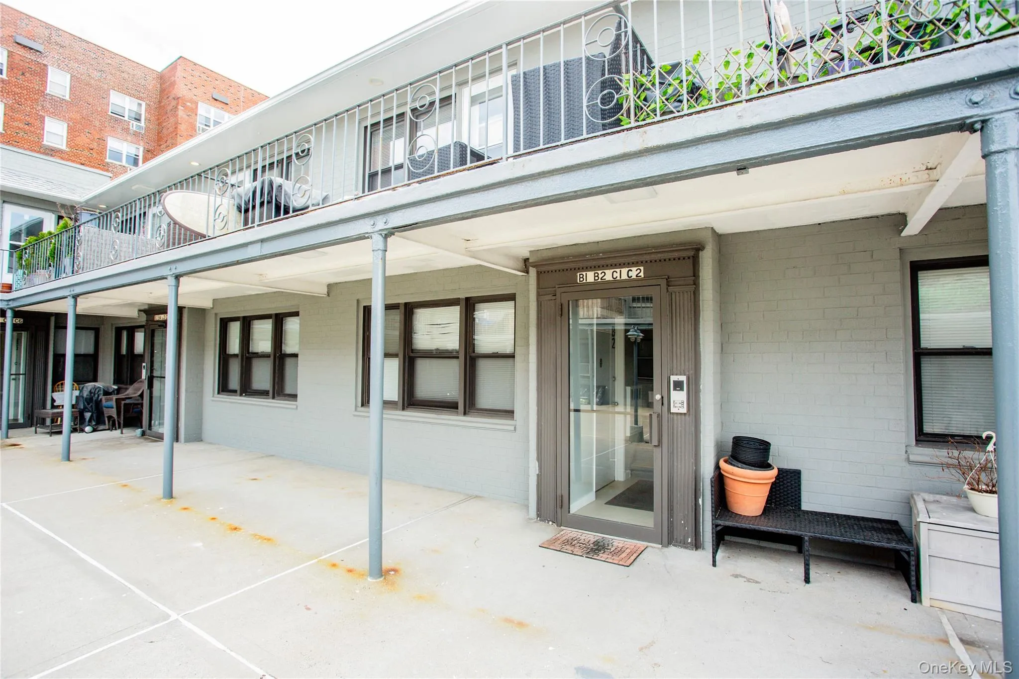 Doorway to property featuring a patio and brick siding Doorway to property featuring a patio and brick siding