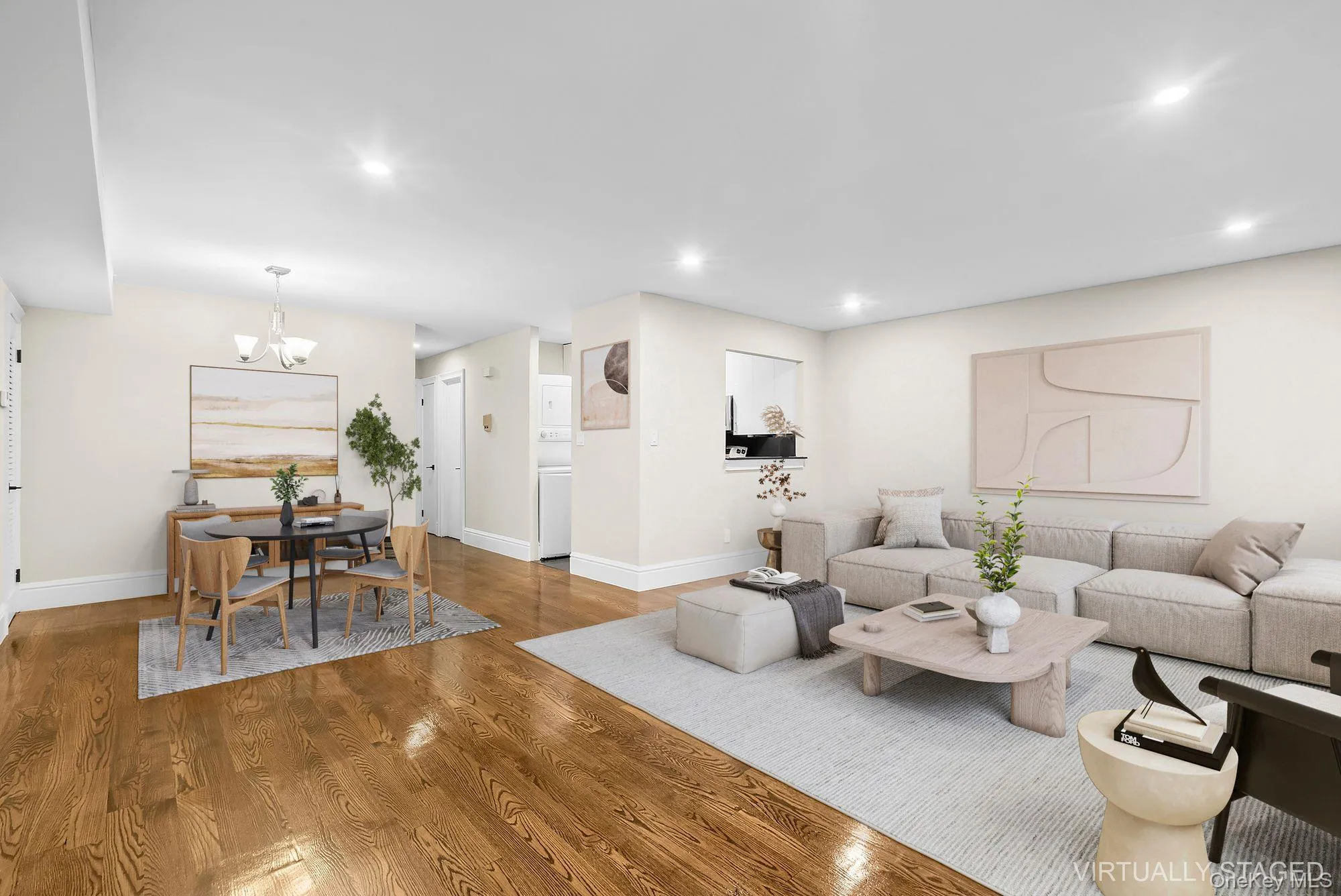 Living area featuring wood finished floors, a chandelier, and recessed lighting Living area featuring wood finished floors, a chandelier, and recessed lighting