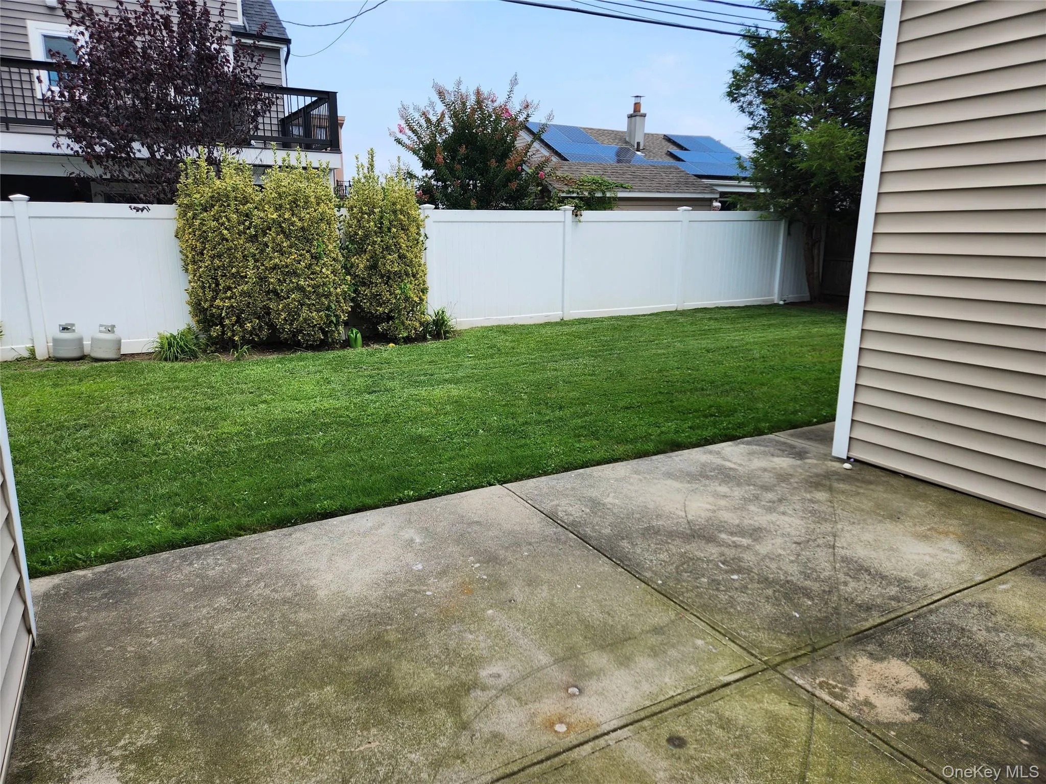 View of yard featuring a patio area View of yard featuring a patio area
