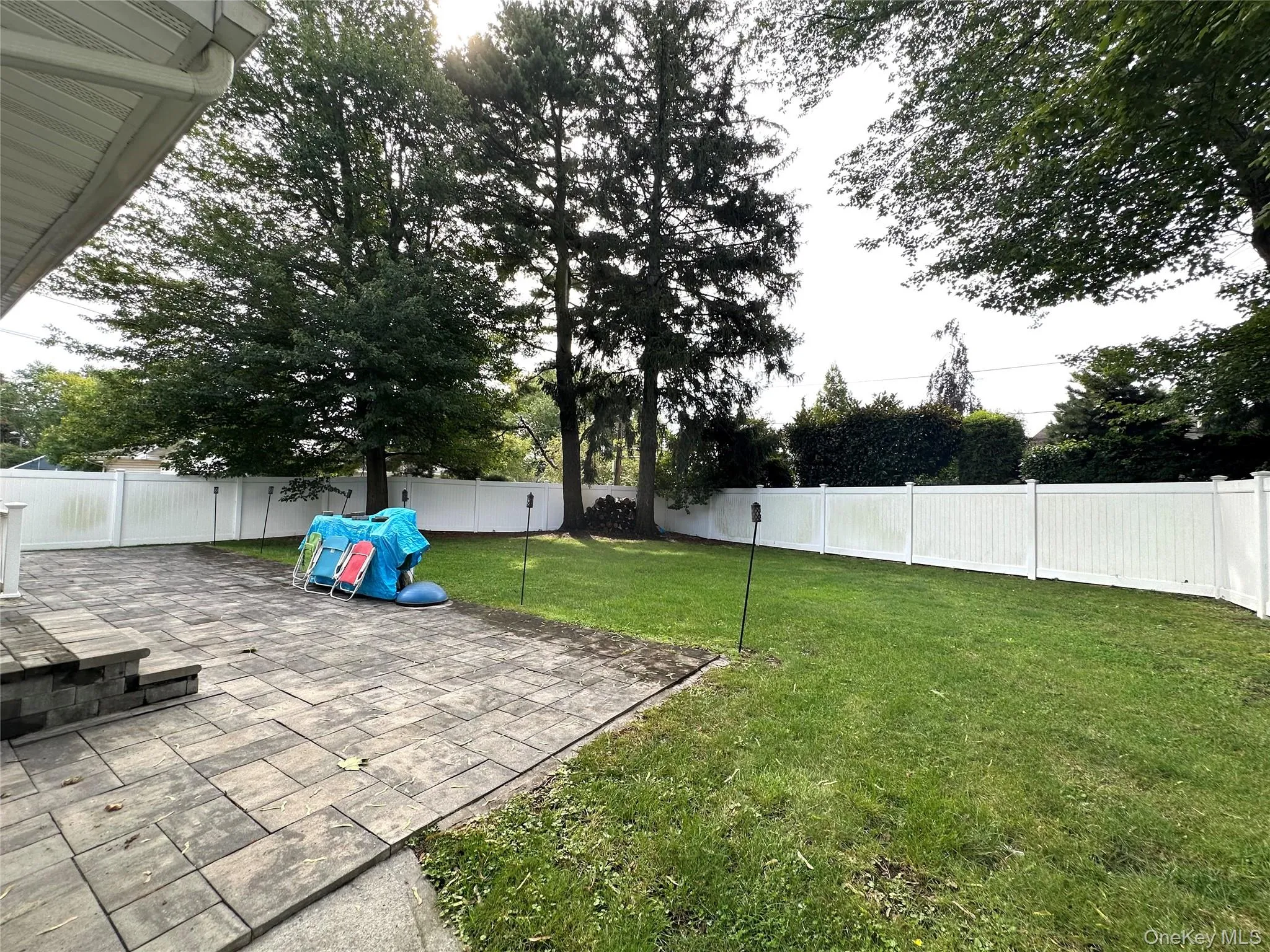 Fenced backyard featuring a patio area Fenced backyard featuring a patio area
