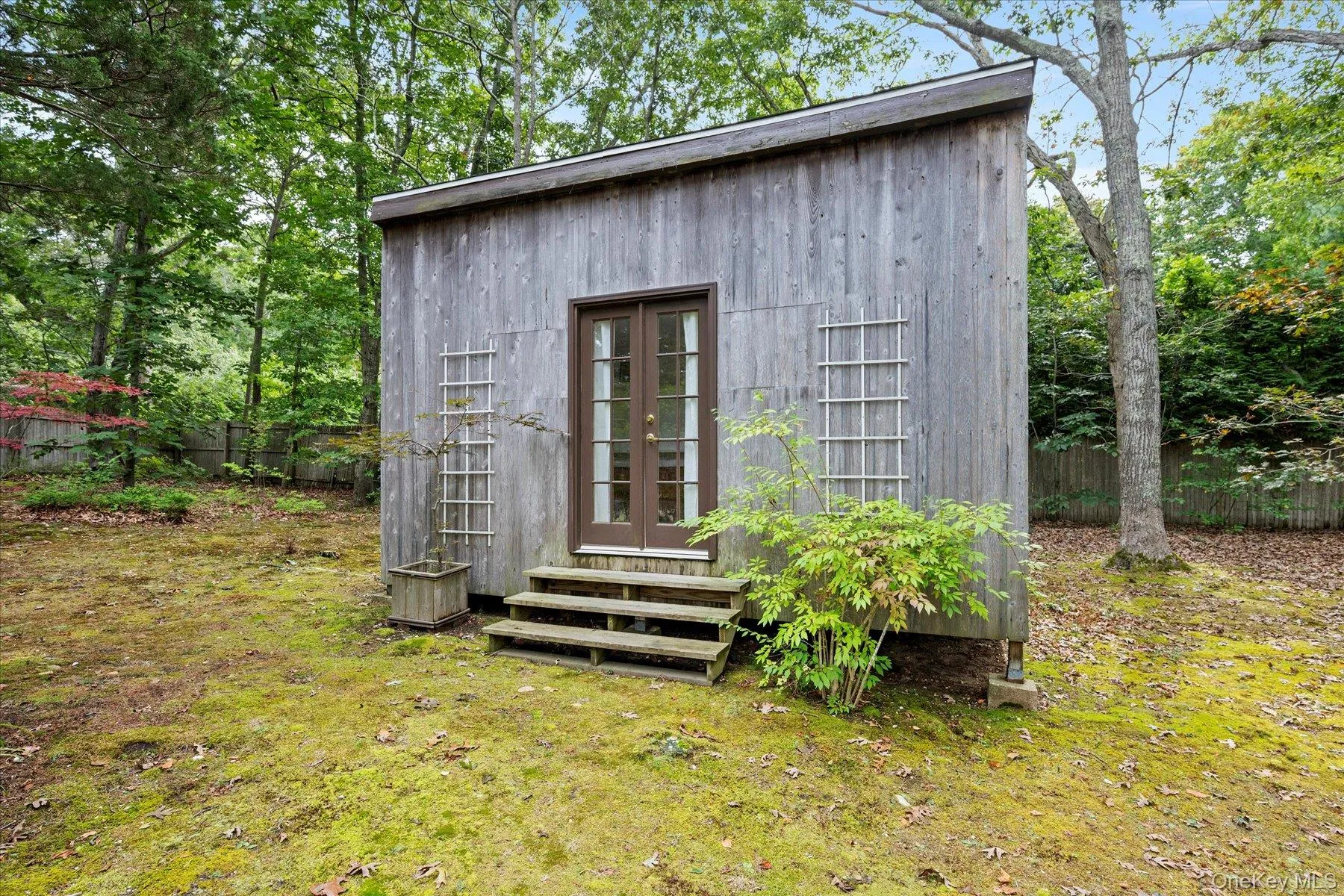 View of outdoor structure featuring a fenced backyard