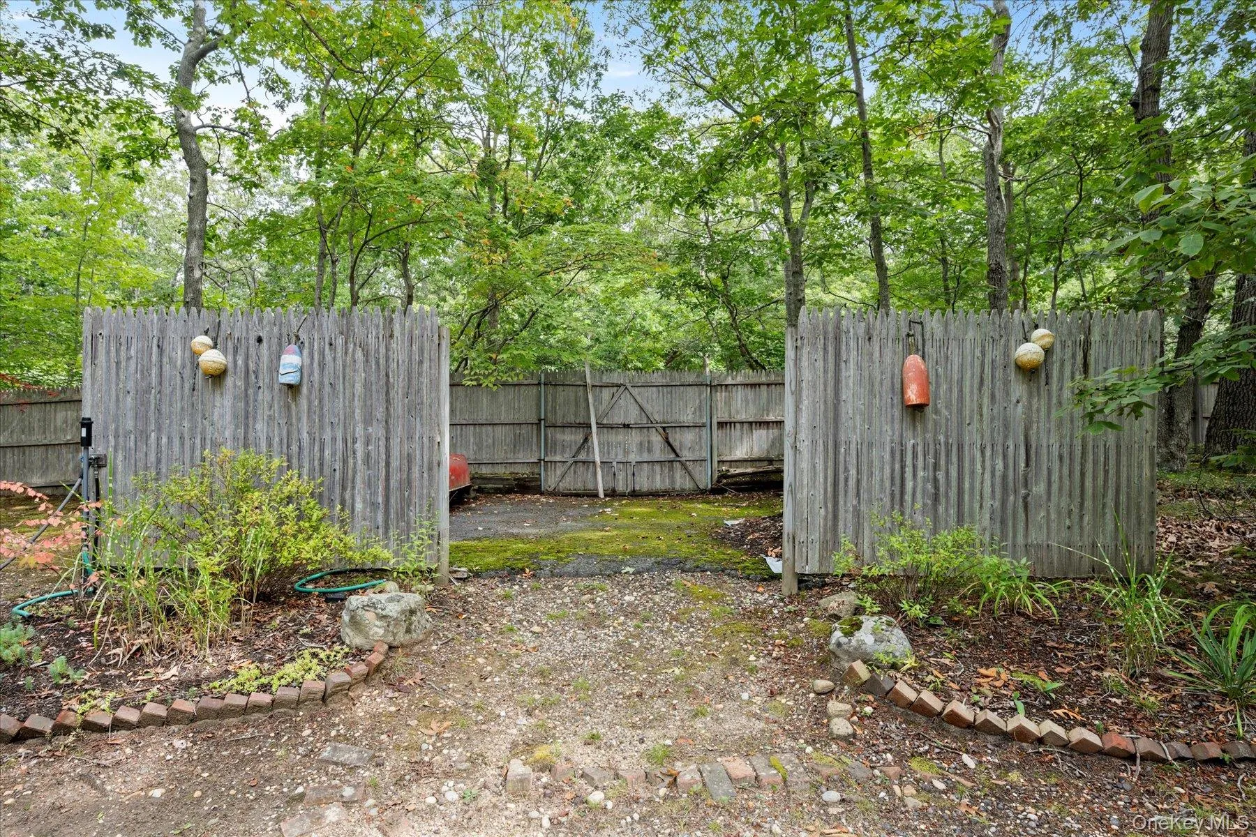 View of yard with view of wooded area