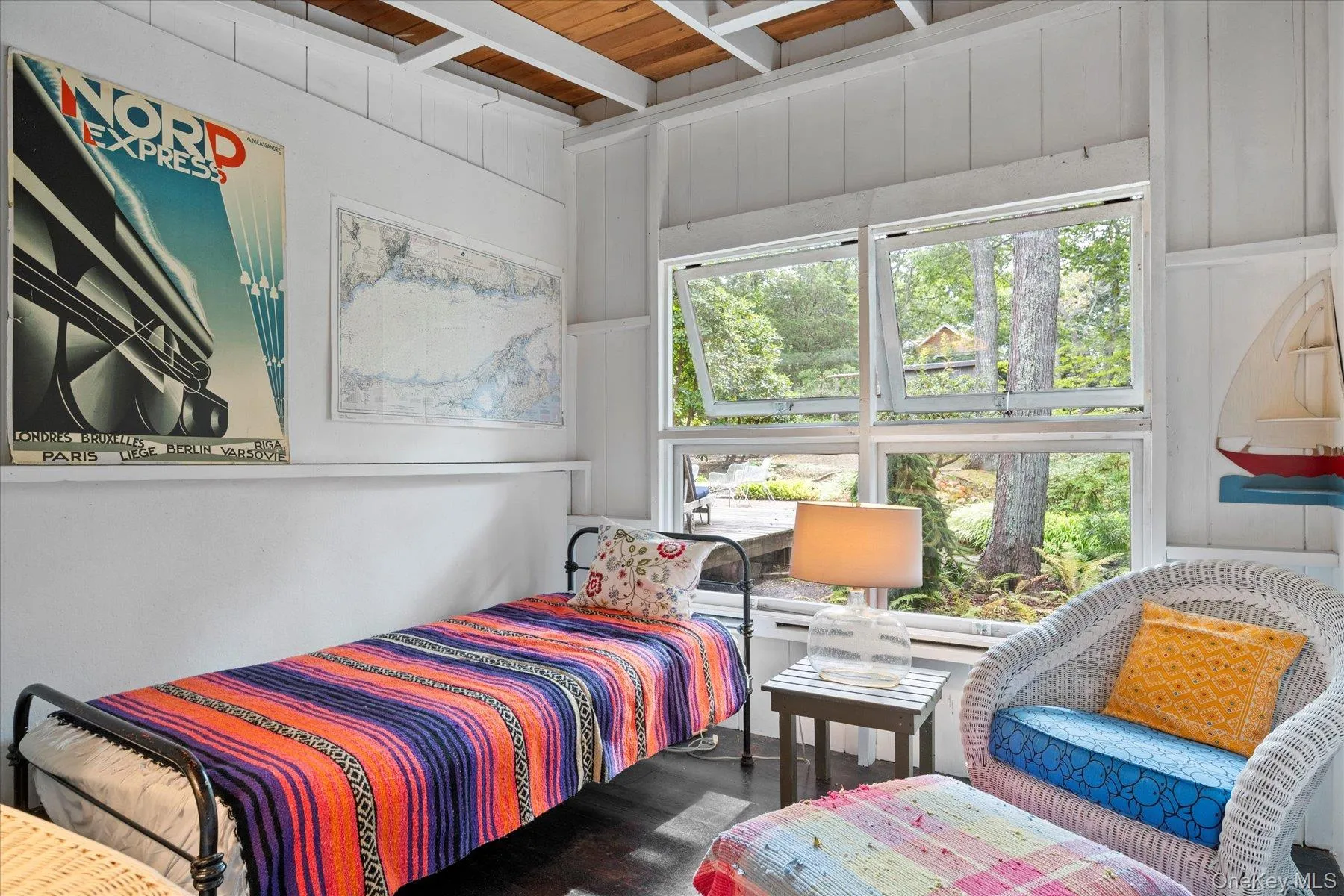 Bedroom featuring a wooden ceiling with exposed beams and wood finished floors