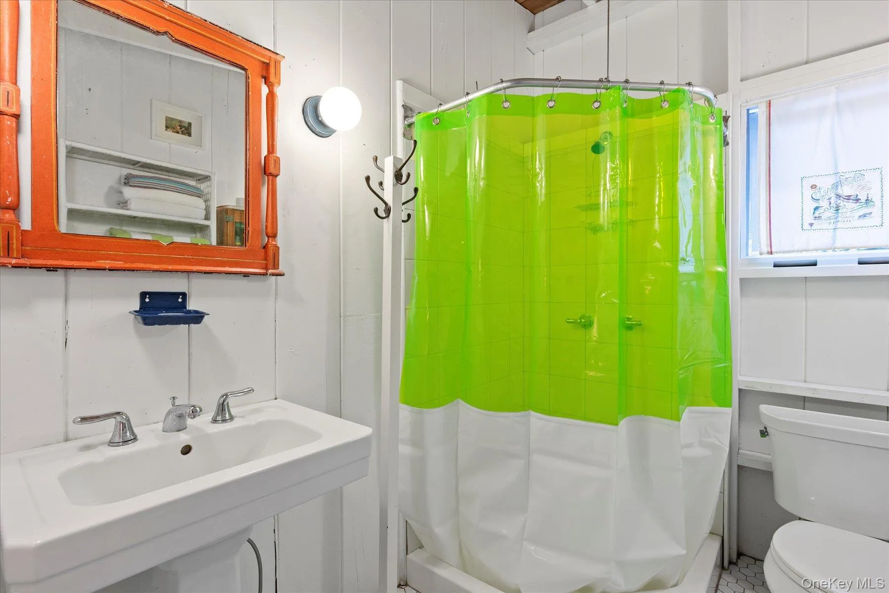 Full bath with toilet and curtained shower