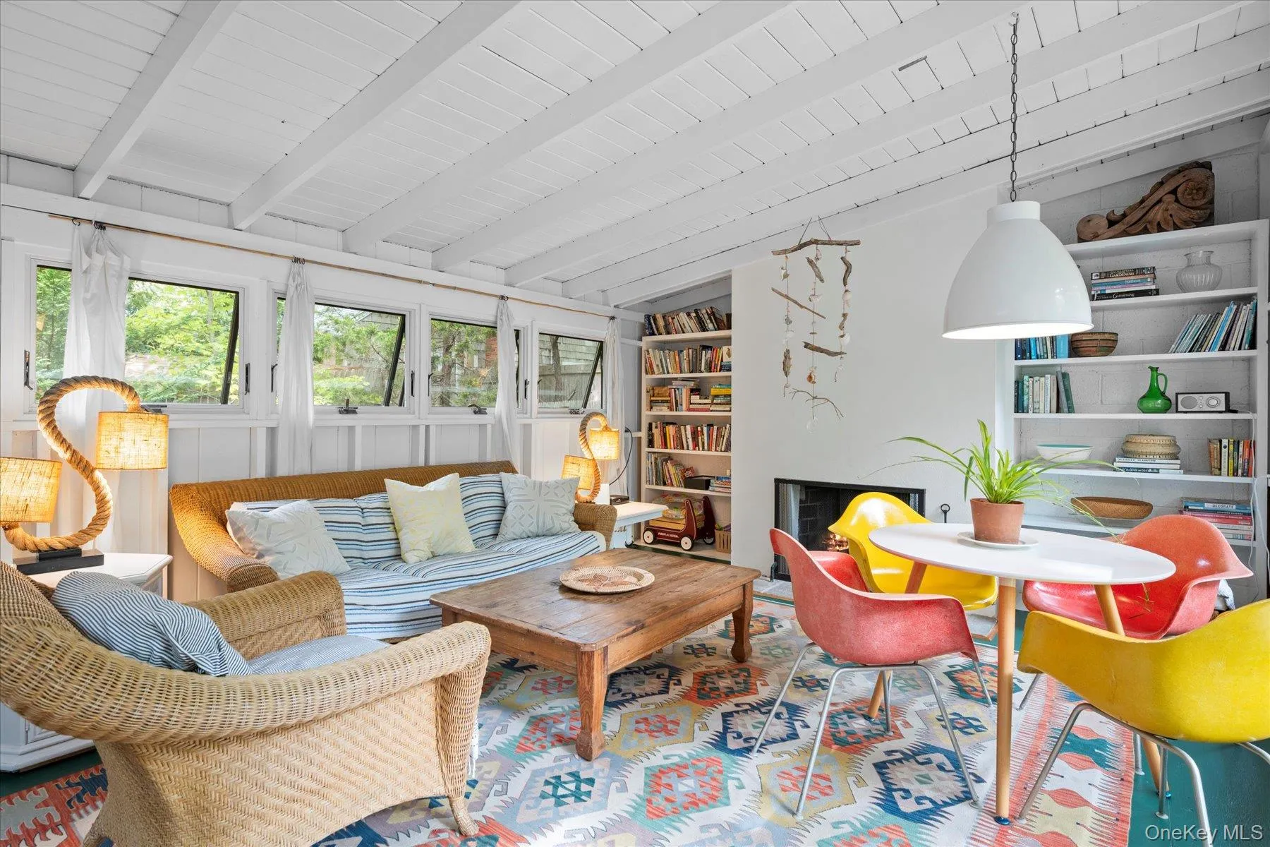 Sunroom featuring beamed ceiling