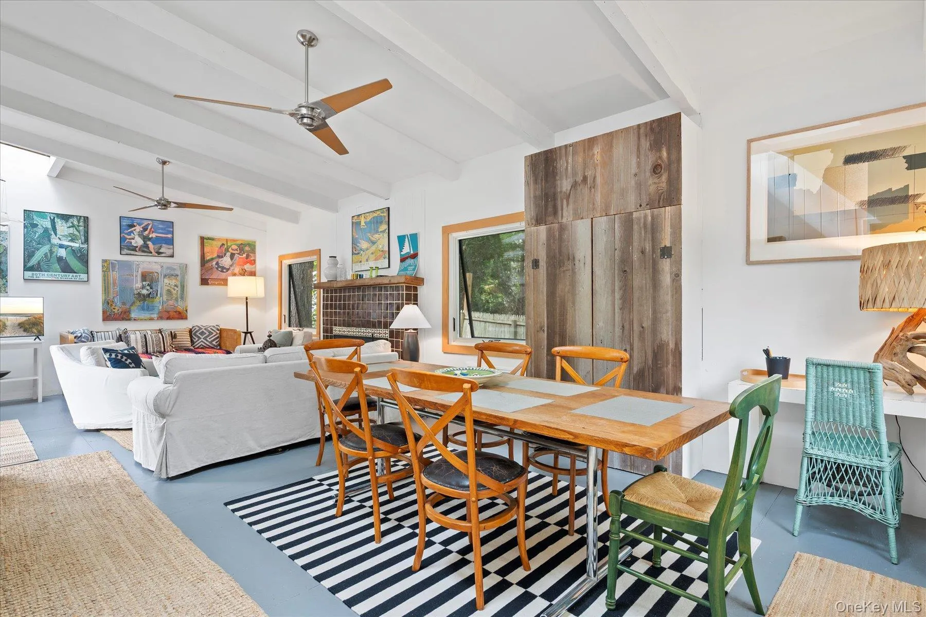 Dining room featuring finished concrete floors and a ceiling fan
