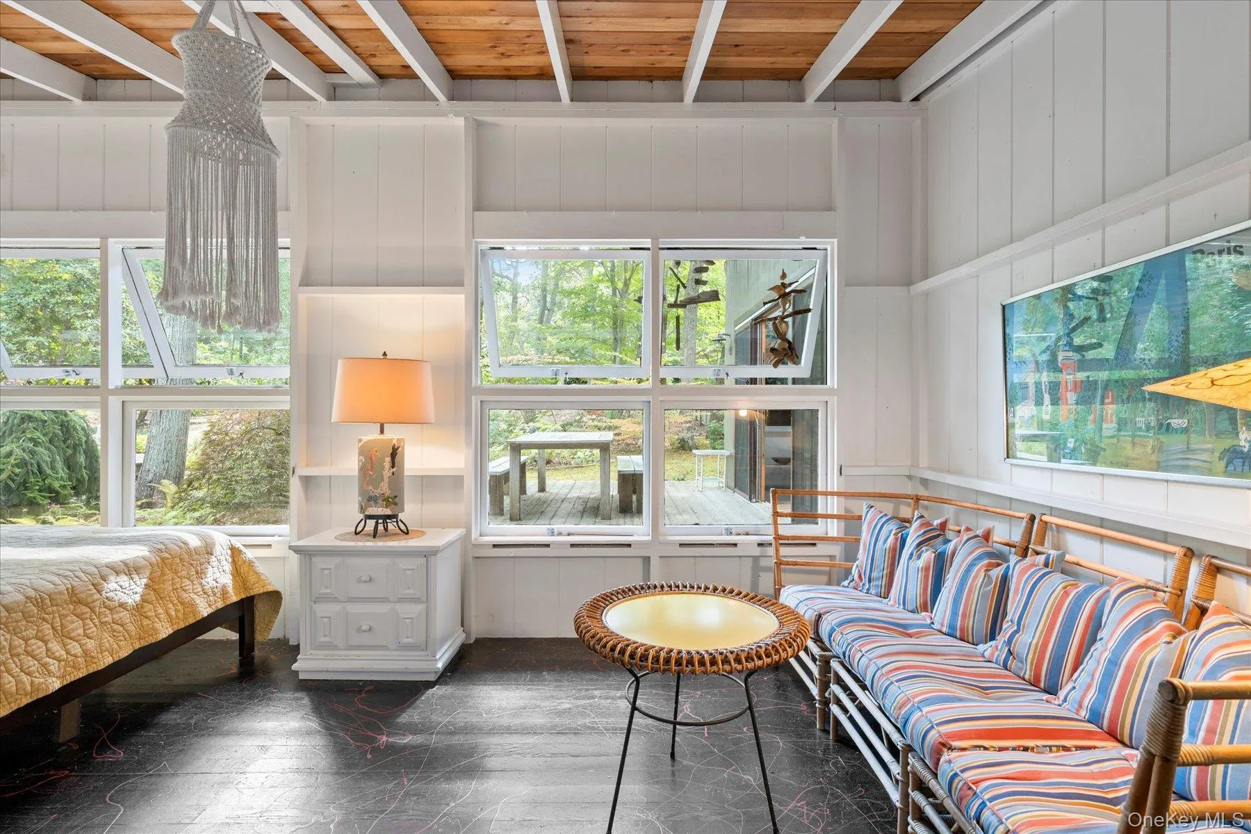 Sunroom / solarium with beamed ceiling and healthy amount of natural light