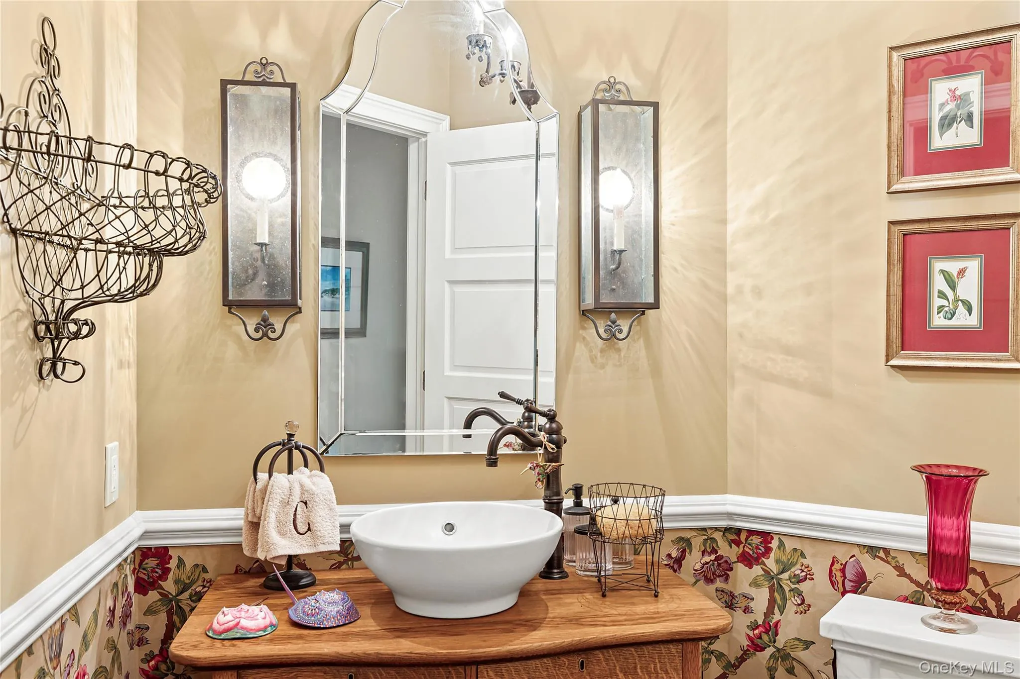 Bathroom with a wainscoted wall and vanity Bathroom with a wainscoted wall and vanity