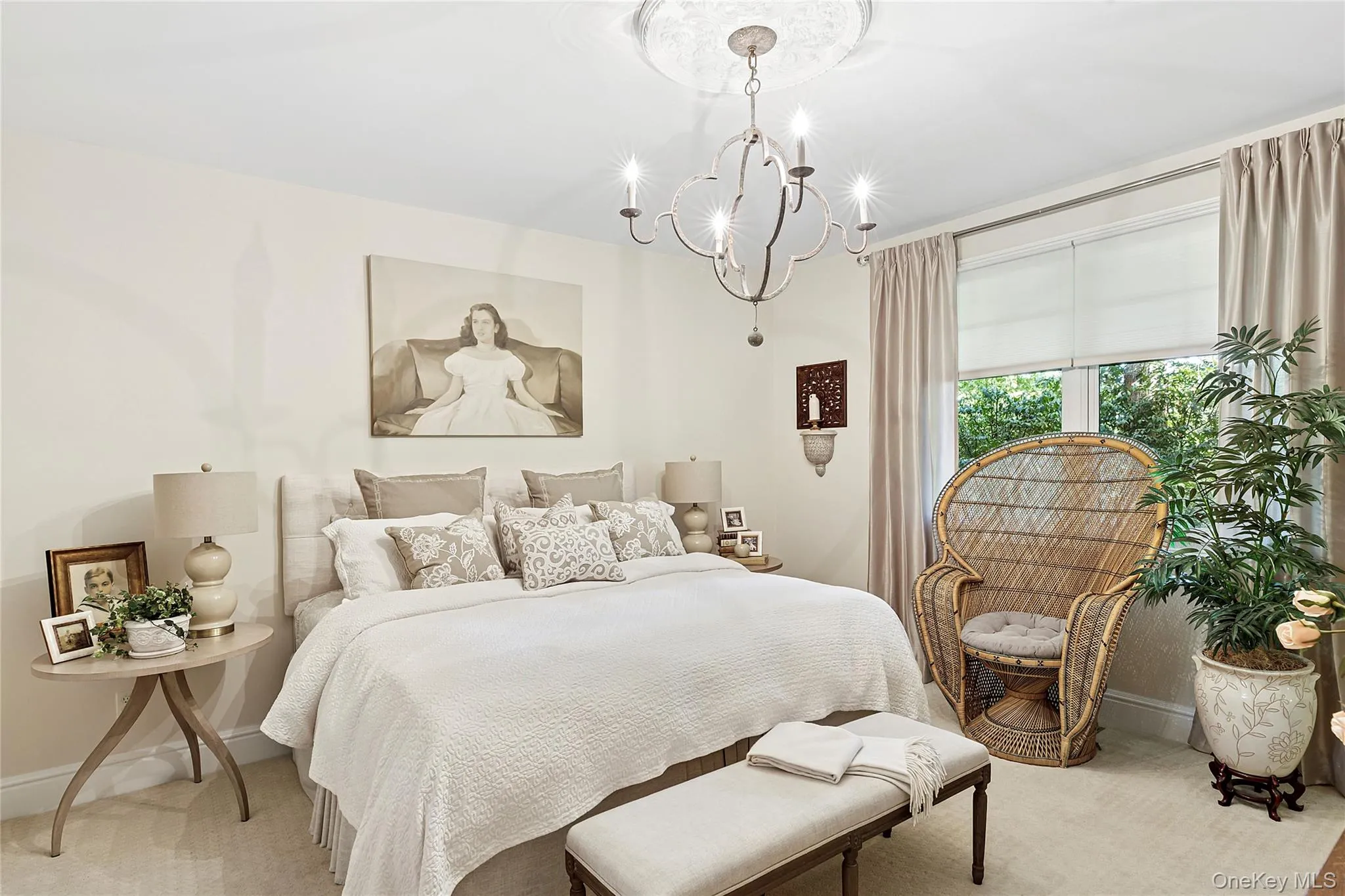 Bedroom with a chandelier and carpet flooring Bedroom with a chandelier and carpet flooring