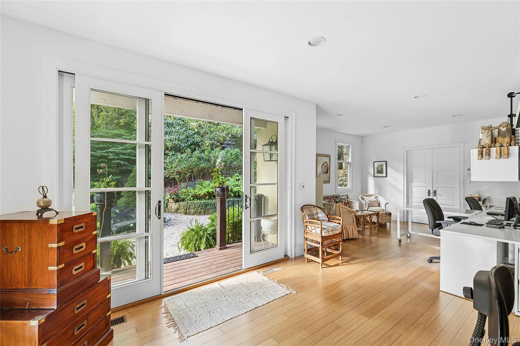 Doorway to outside with an office area, hardwood / wood-style floors, and recessed lighting Doorway to outside with an office area, hardwood / wood-style floors, and recessed lighting