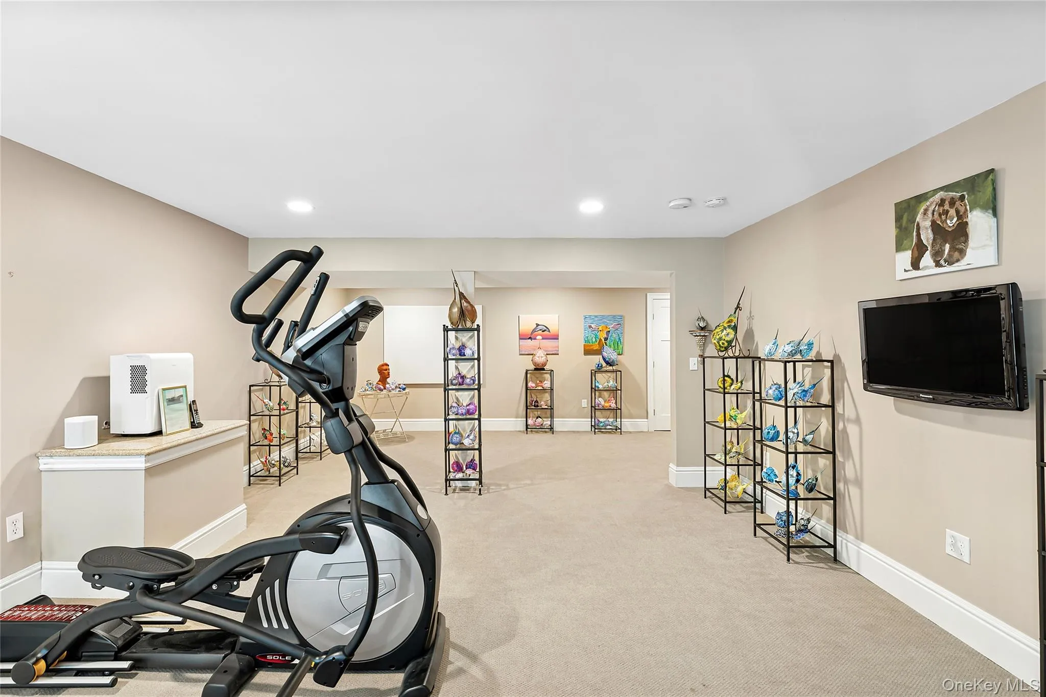 Workout room featuring light carpet and recessed lighting Workout room featuring light carpet and recessed lighting