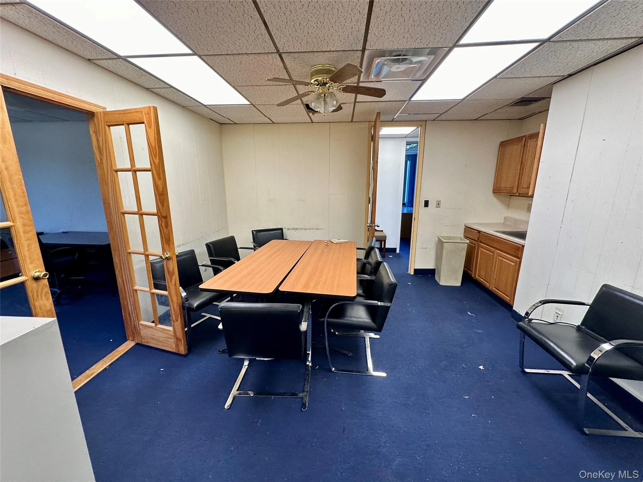 Dining space with a drop ceiling and ceiling fan Dining space with a drop ceiling and ceiling fan