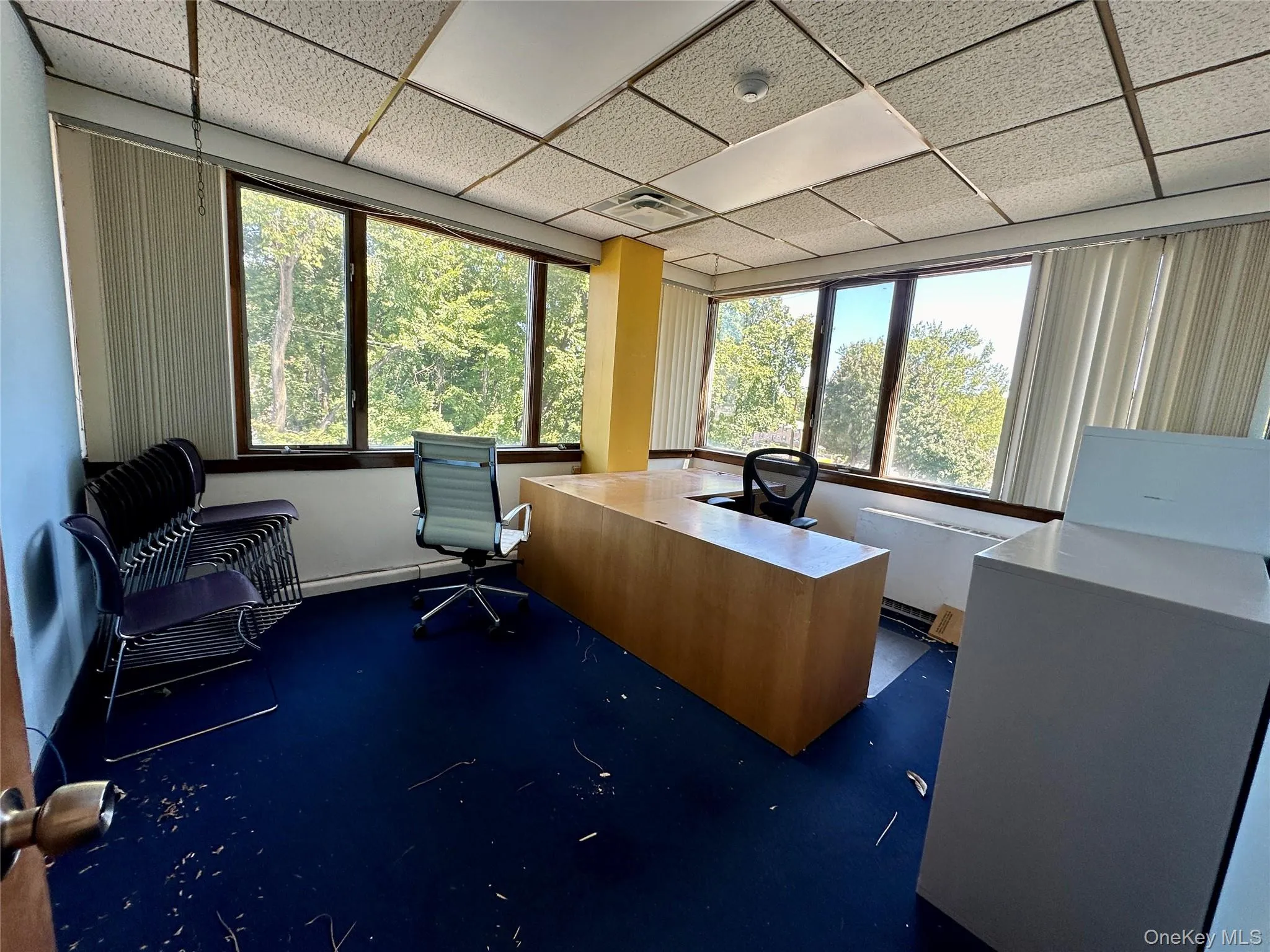 Office featuring a drop ceiling Office featuring a drop ceiling
