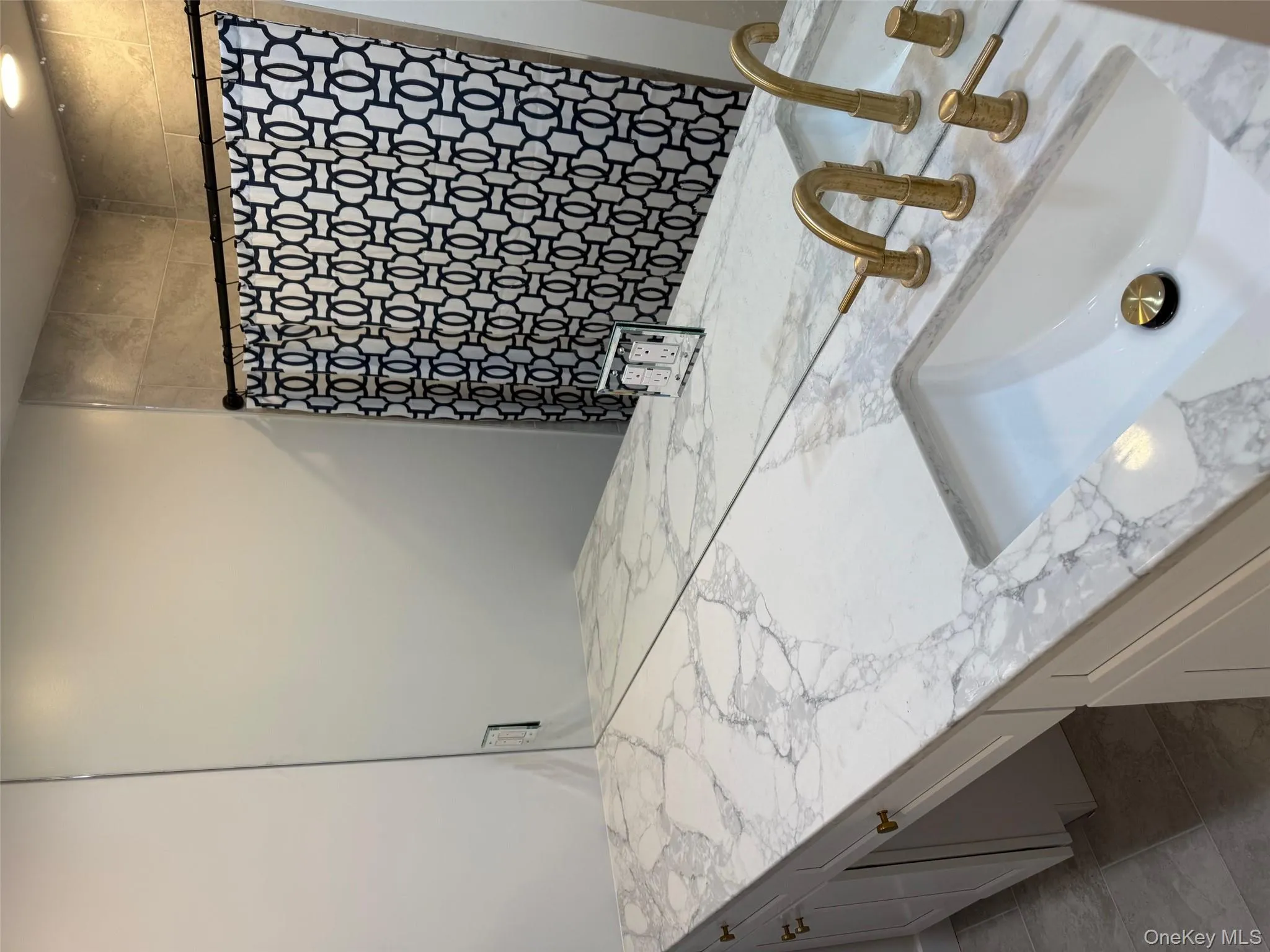 Full bath featuring vanity and tiled shower Full bath featuring vanity and tiled shower