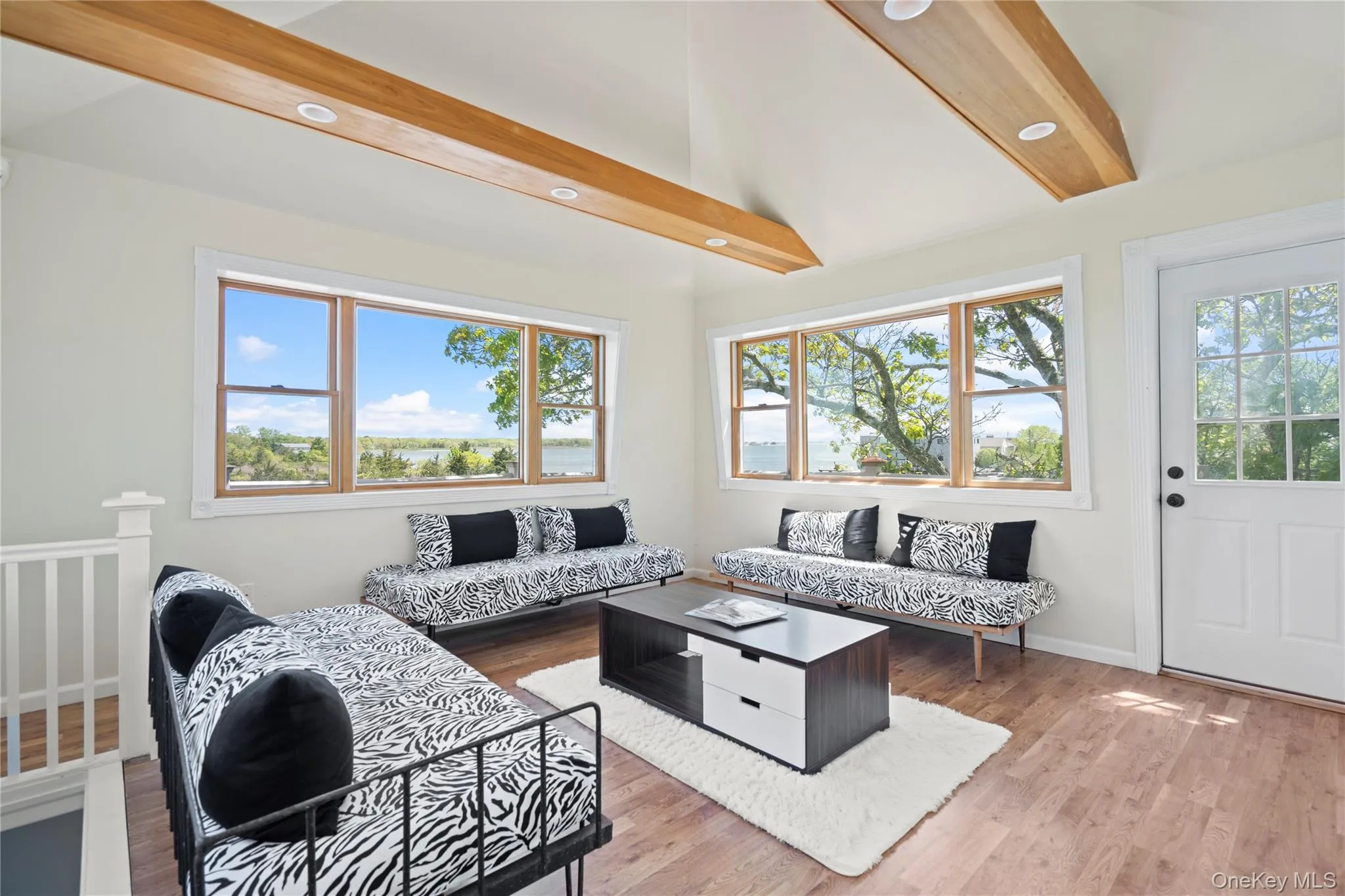 Living room with wood finished floors and recessed lighting Living room with wood finished floors and recessed lighting