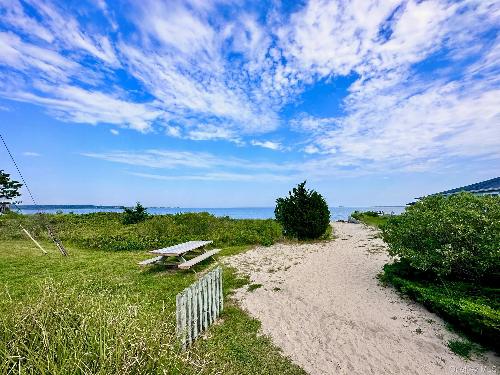 View of yard with a water view View of yard with a water view