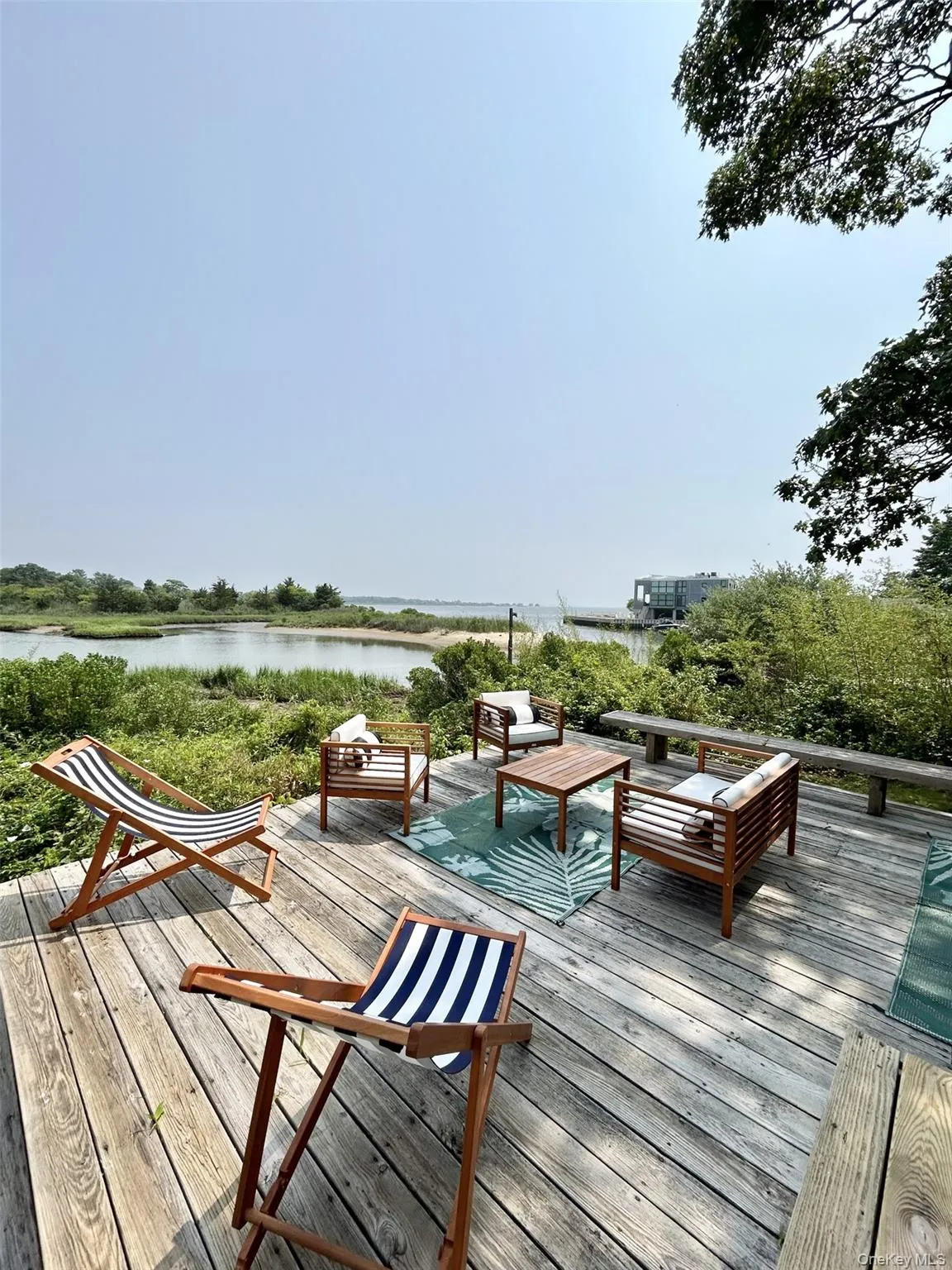 Wooden deck featuring a water view Wooden deck featuring a water view