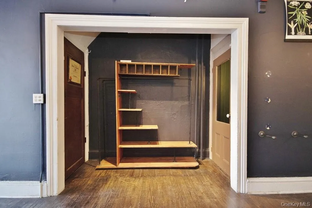 Front Room / Retail Space With Closet On Left and Entrance to Basement on Right Front Room / Retail Space With Closet On Left and Entrance to Basement on Right