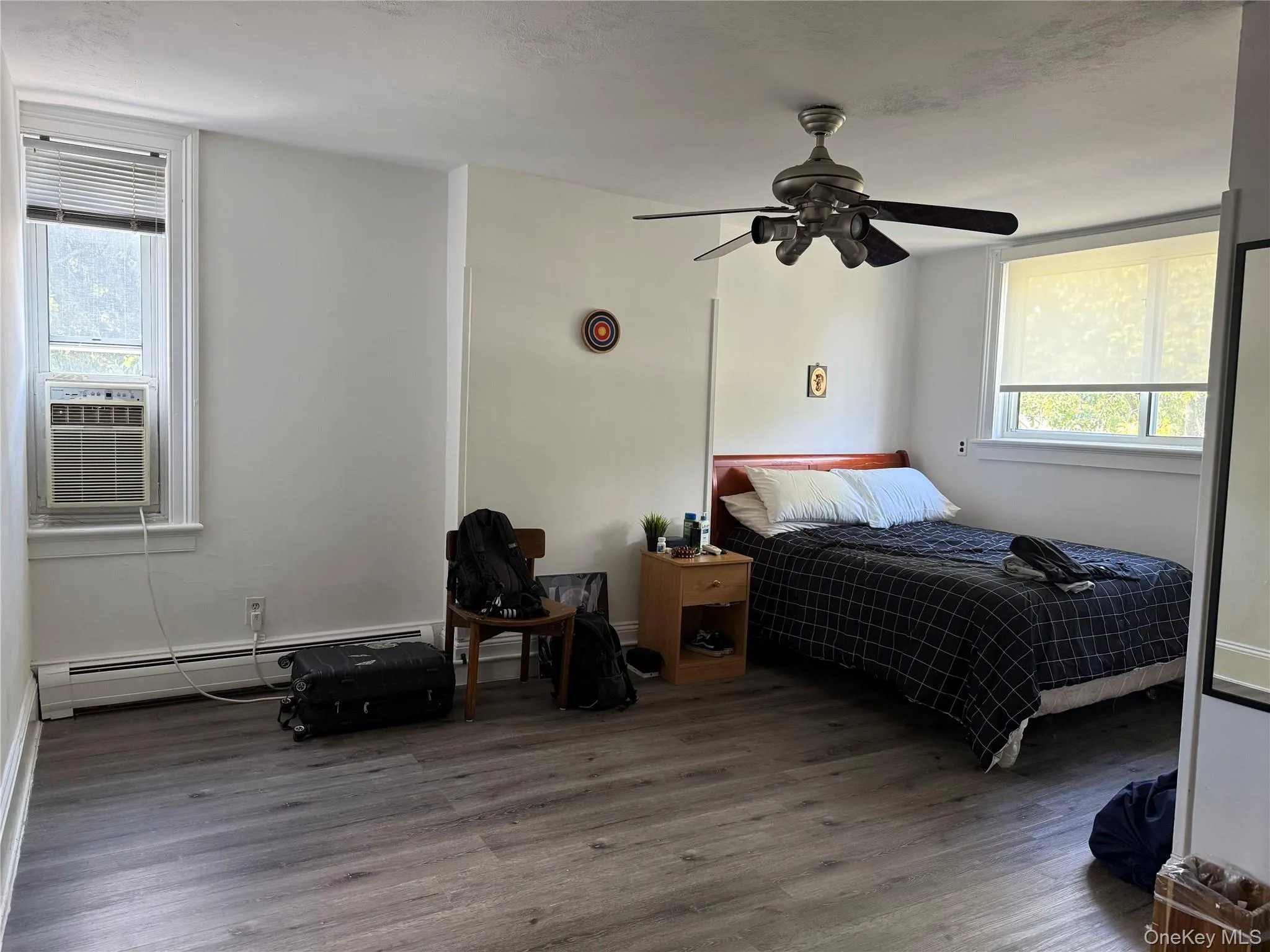 New floors in Bedroom 1, which also has an AC, fan, and walk-in closet New floors in Bedroom 1, which also has an AC, fan, and walk-in closet