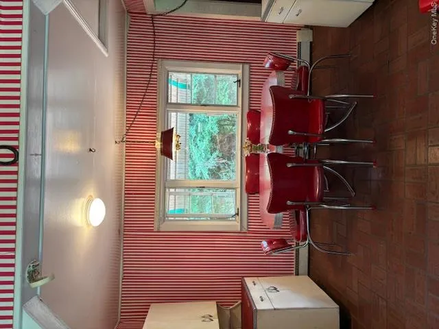 Main House Vintage Dining Room open to kitchen with wallpapered walls, , nice amount of light facing field Main House Vintage Dining Room open to kitchen with wallpapered walls, , nice amount of light facing field