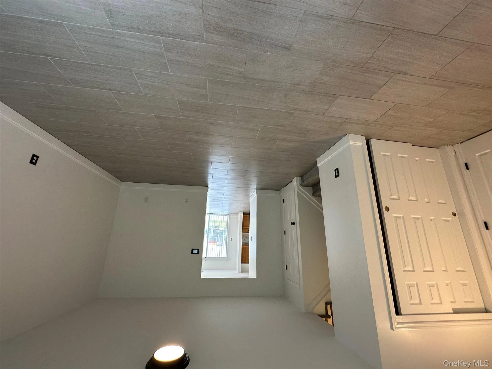 Unfurnished room with stairs and baseboards Unfurnished room with stairs and baseboards