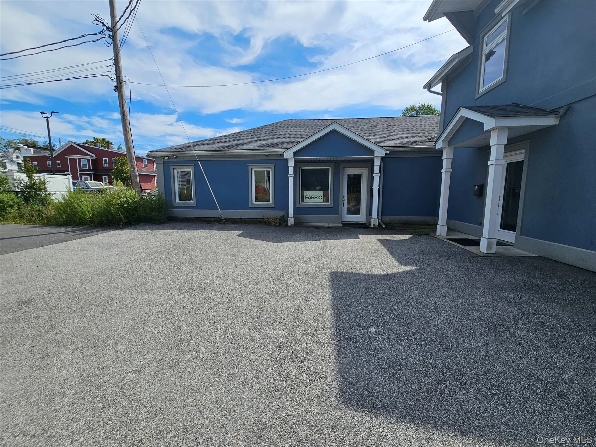 View of front of property featuring roof with shingles and stucco siding View of front of property featuring roof with shingles and stucco siding