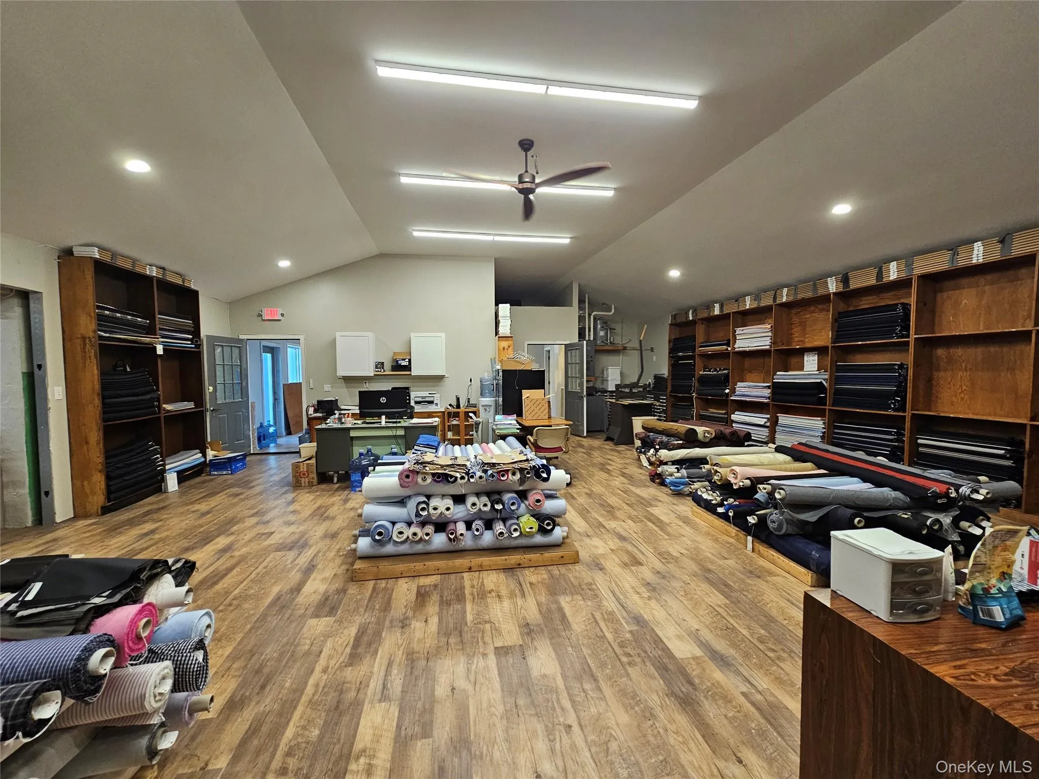 Miscellaneous room featuring lofted ceiling, ceiling fan, wood finished floors, and recessed lighting Miscellaneous room featuring lofted ceiling, ceiling fan, wood finished floors, and recessed lighting