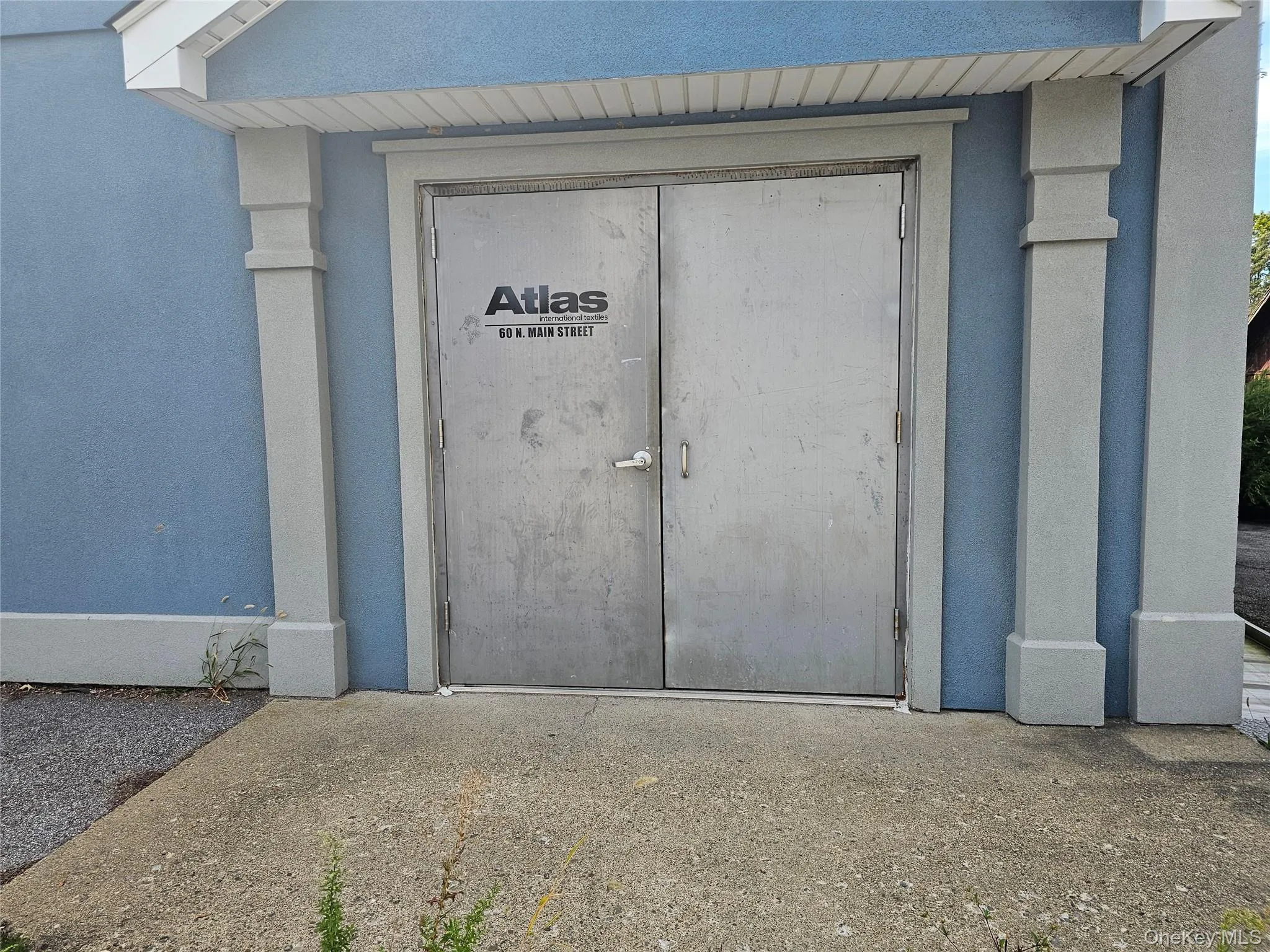 Entrance to property with stucco siding Entrance to property with stucco siding