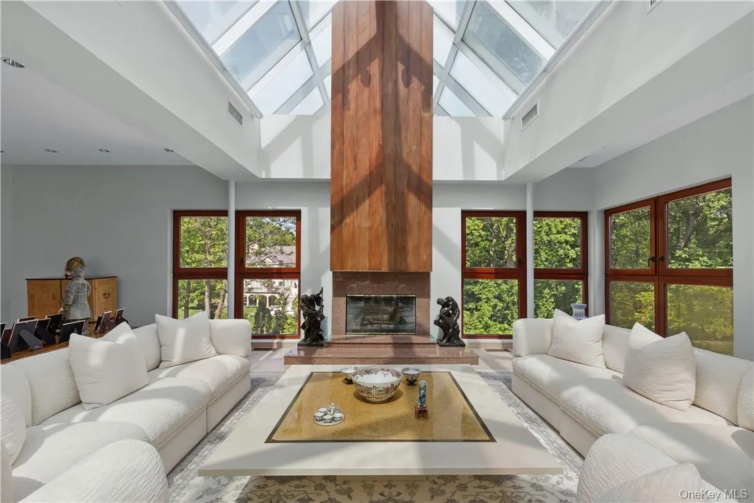 Light and Bright Living Room featuring Soaring Ceiling with Glass Roof, Large windows and Fireplace Light and Bright Living Room featuring Soaring Ceiling with Glass Roof, Large windows and Fireplace