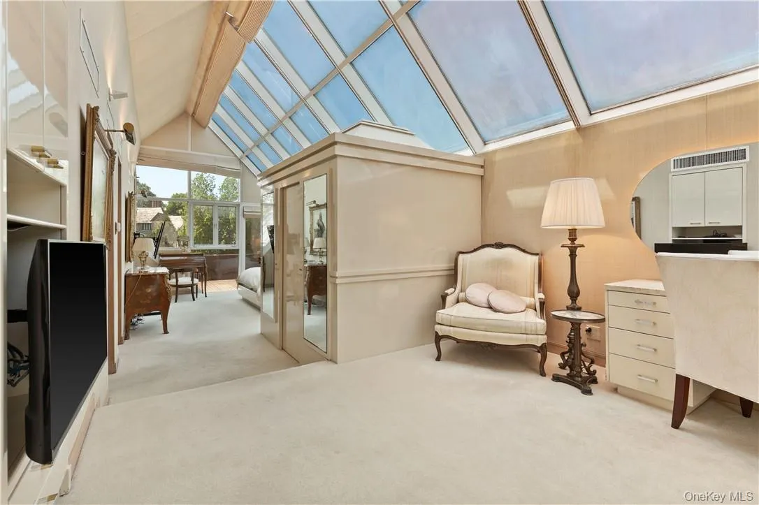Entry to Primary Suite showing Seating Area, Built-Ins and Glass Ceiling Entry to Primary Suite showing Seating Area, Built-Ins and Glass Ceiling