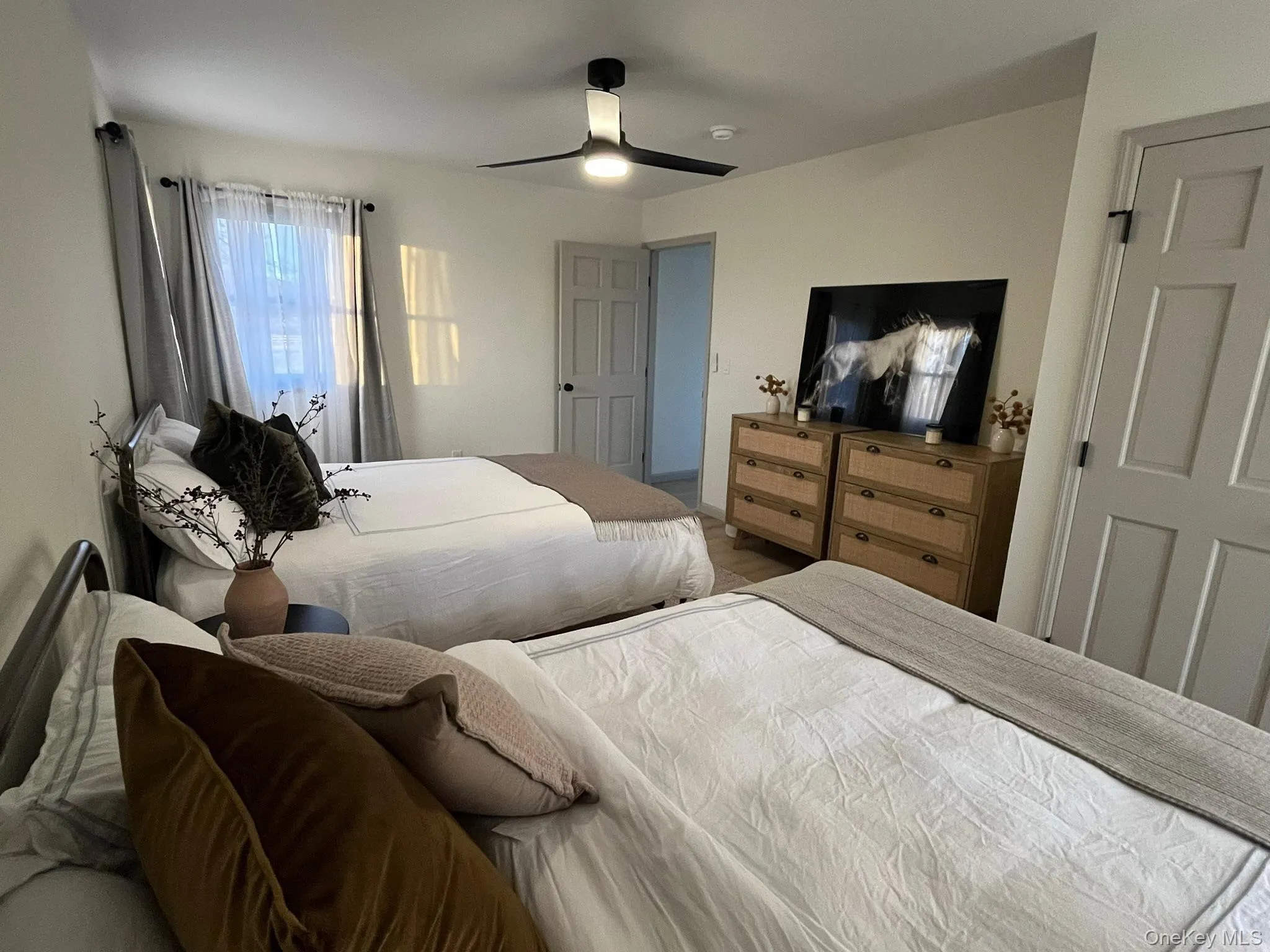 Bedroom featuring a ceiling fan Bedroom featuring a ceiling fan