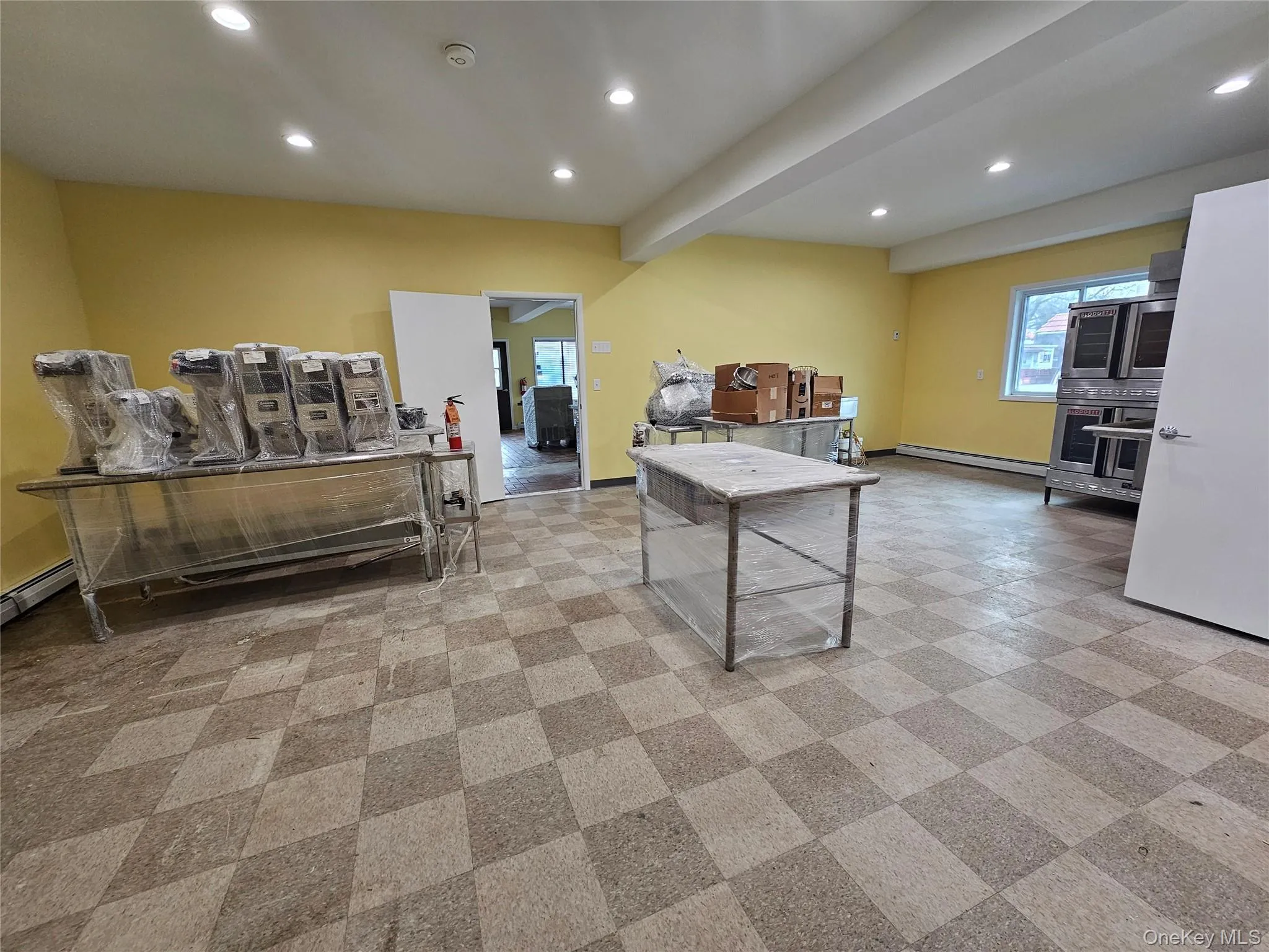 Game room with recessed lighting, baseboard heating, and beam ceiling Game room with recessed lighting, baseboard heating, and beam ceiling