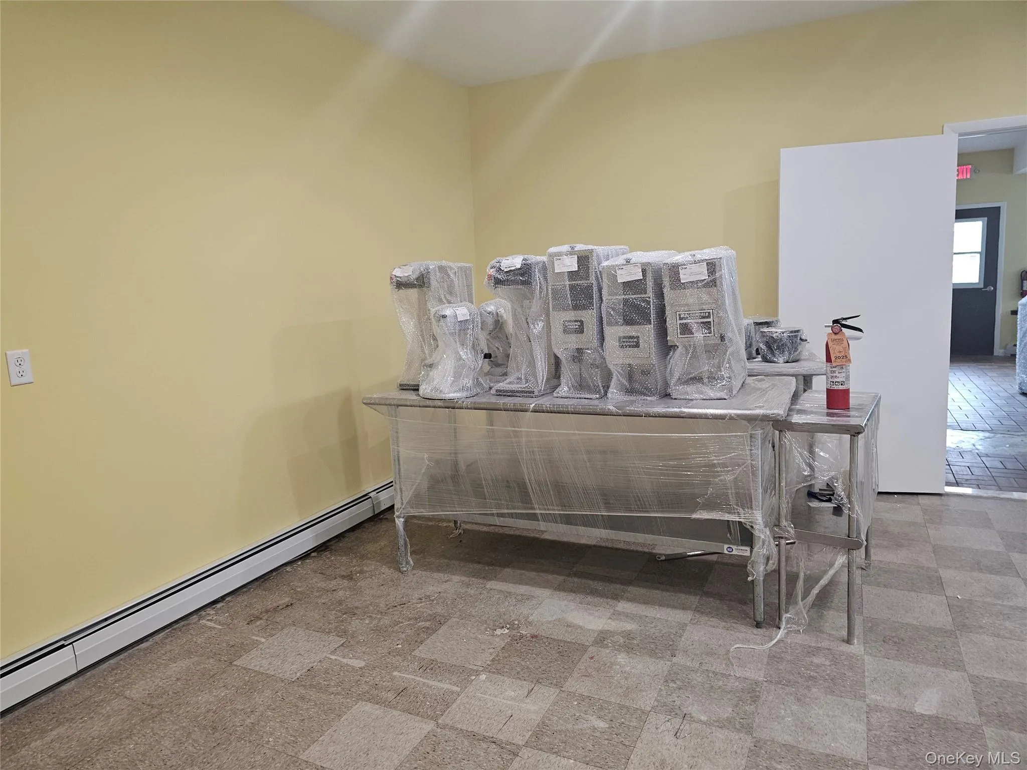 Detailed view of baseboard heating and tile patterned floors Detailed view of baseboard heating and tile patterned floors