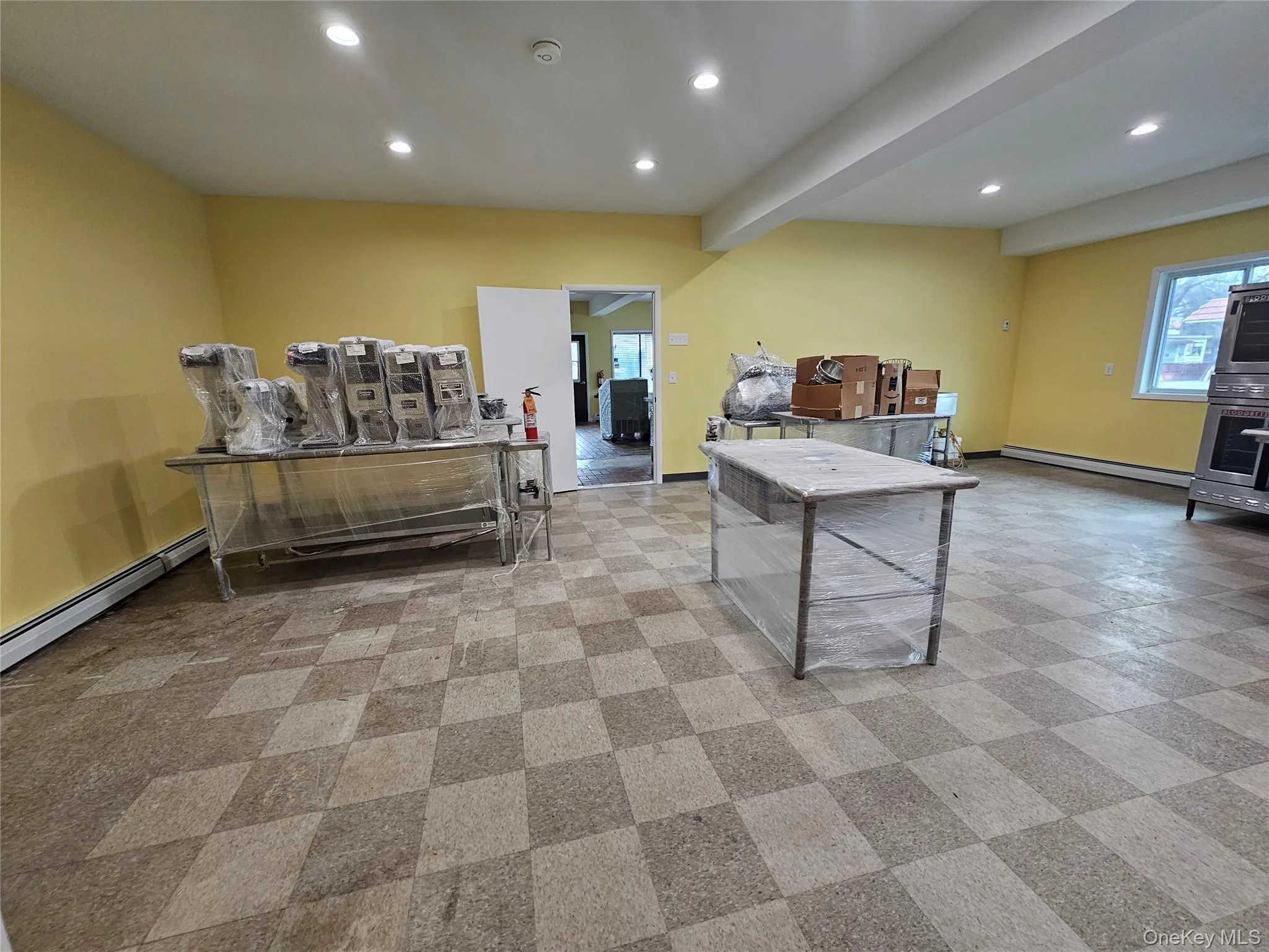 Playroom with recessed lighting, beamed ceiling, and baseboard heating Playroom with recessed lighting, beamed ceiling, and baseboard heating