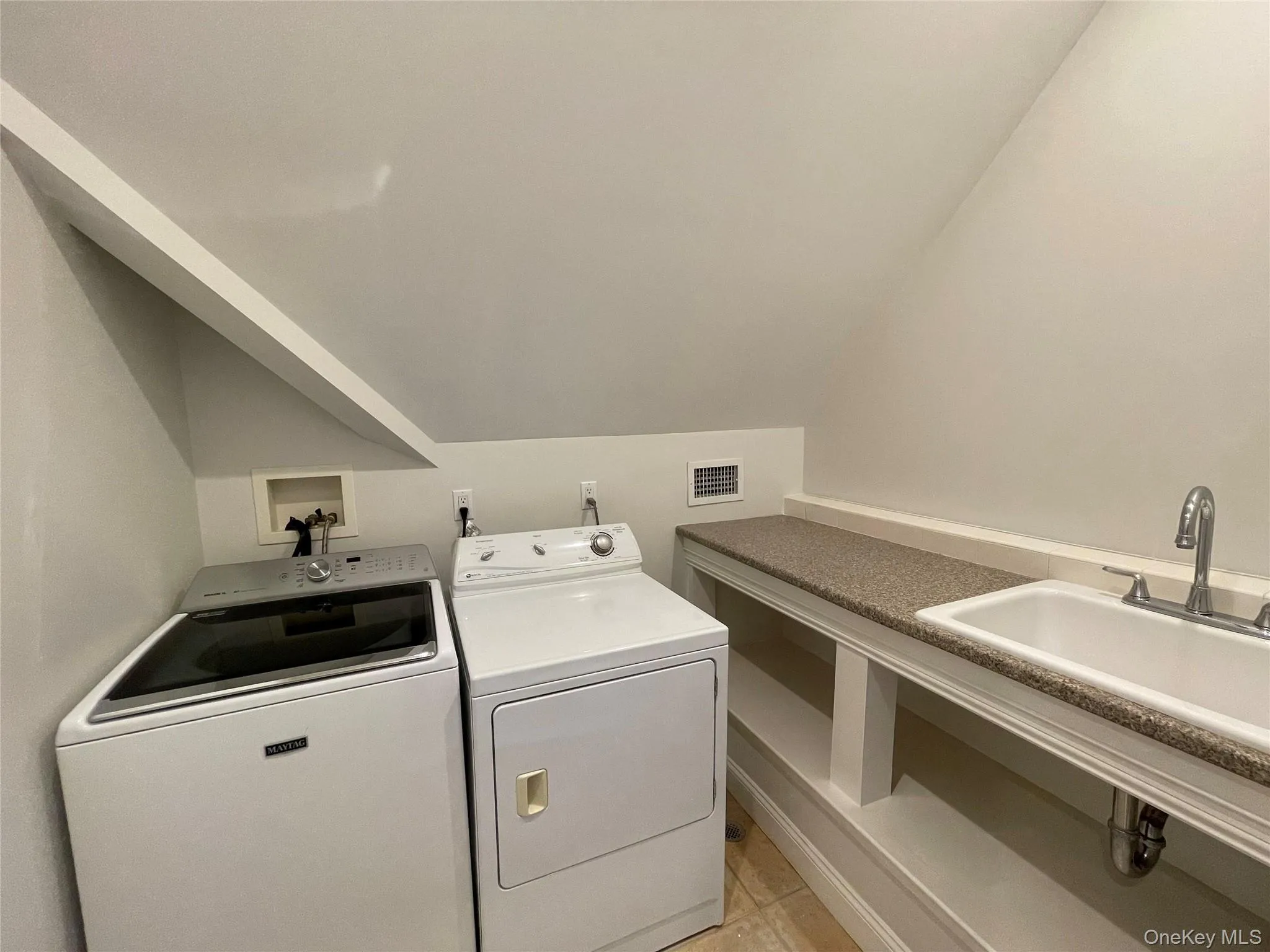 Laundry area featuring washing machine and dryer Laundry area featuring washing machine and dryer