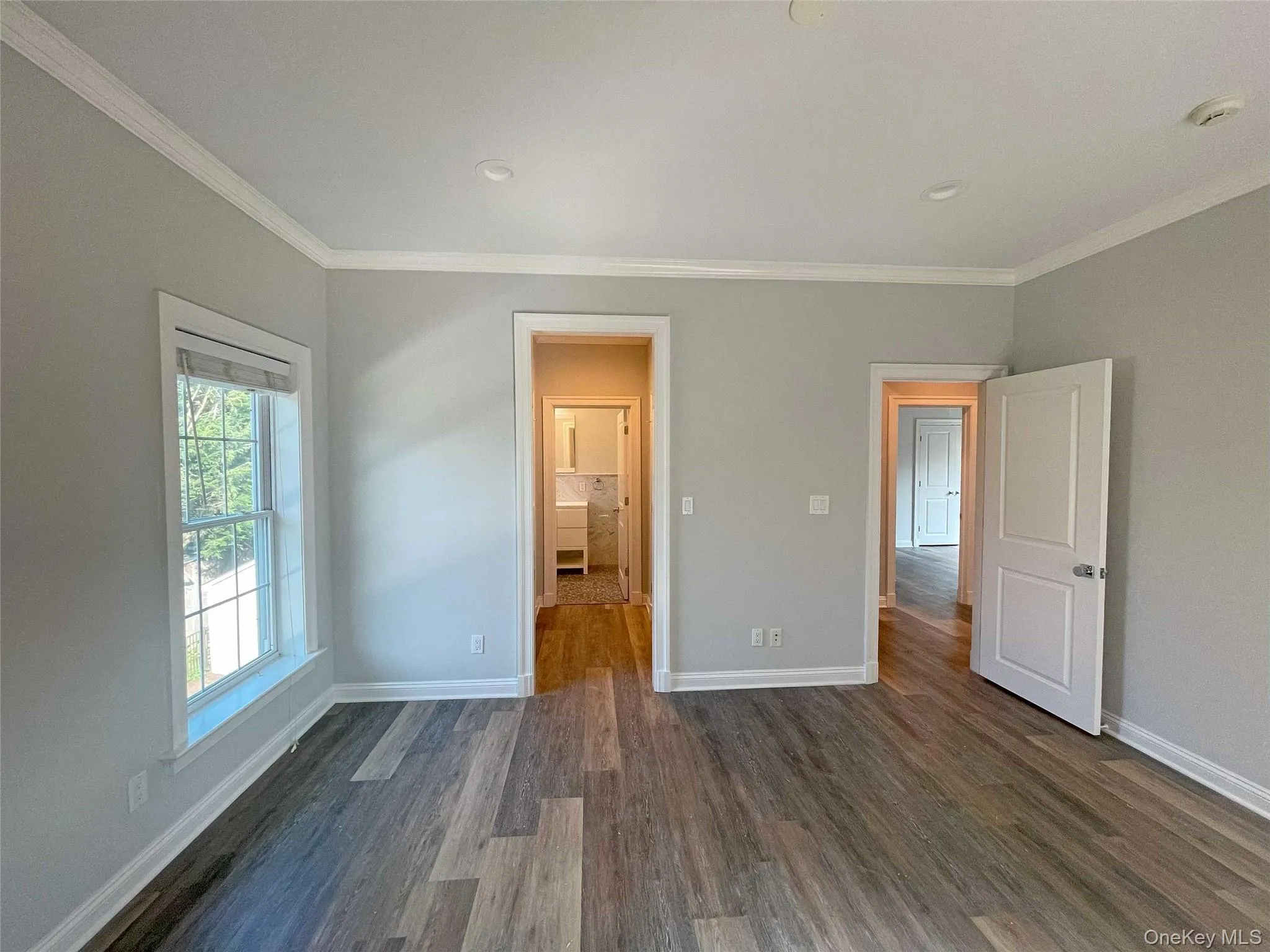 Hallway has 2 walk-in-closets and primary bathroom Hallway has 2 walk-in-closets and primary bathroom