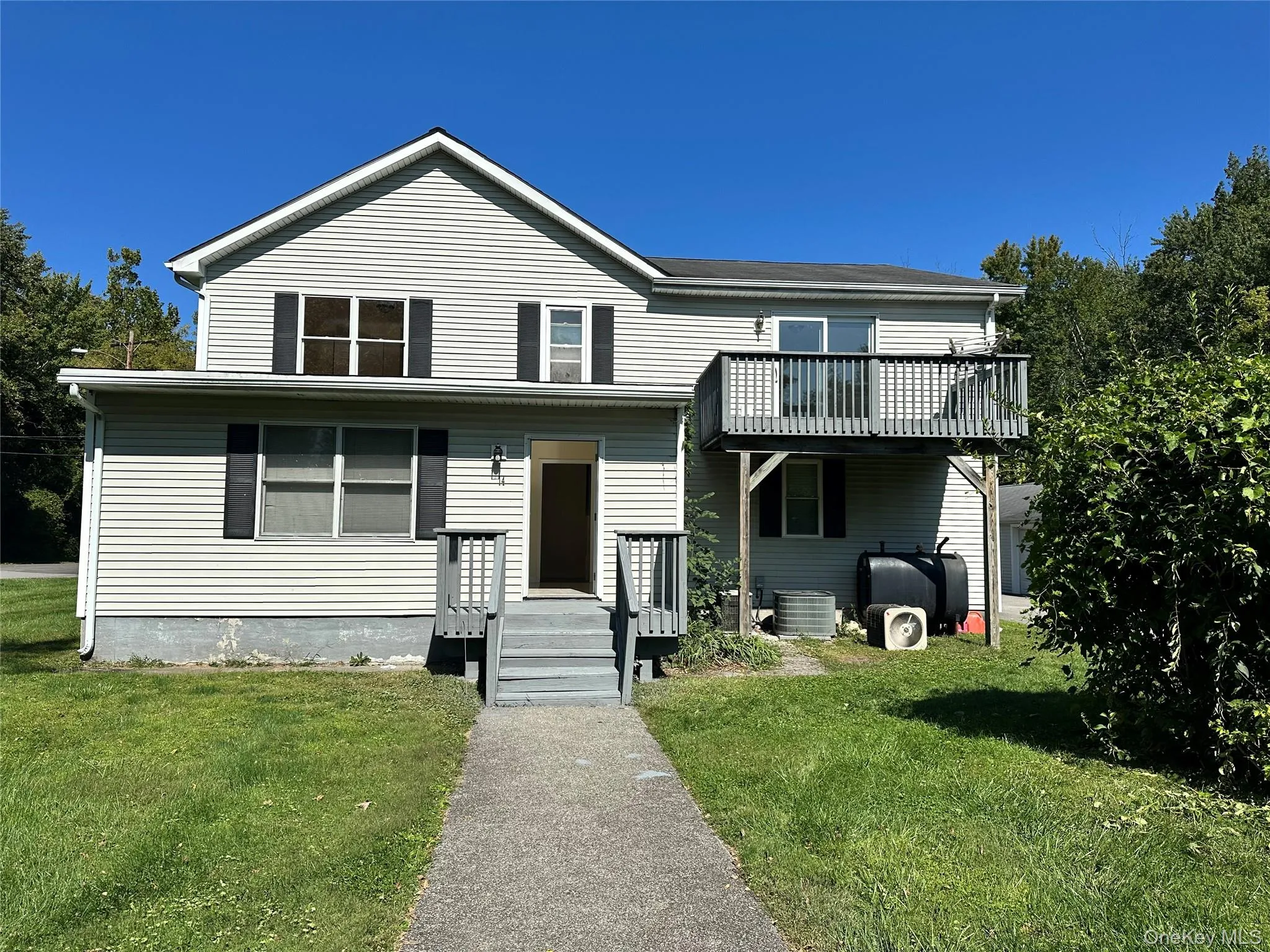 Traditional-style house with a front yard Traditional-style house with a front yard