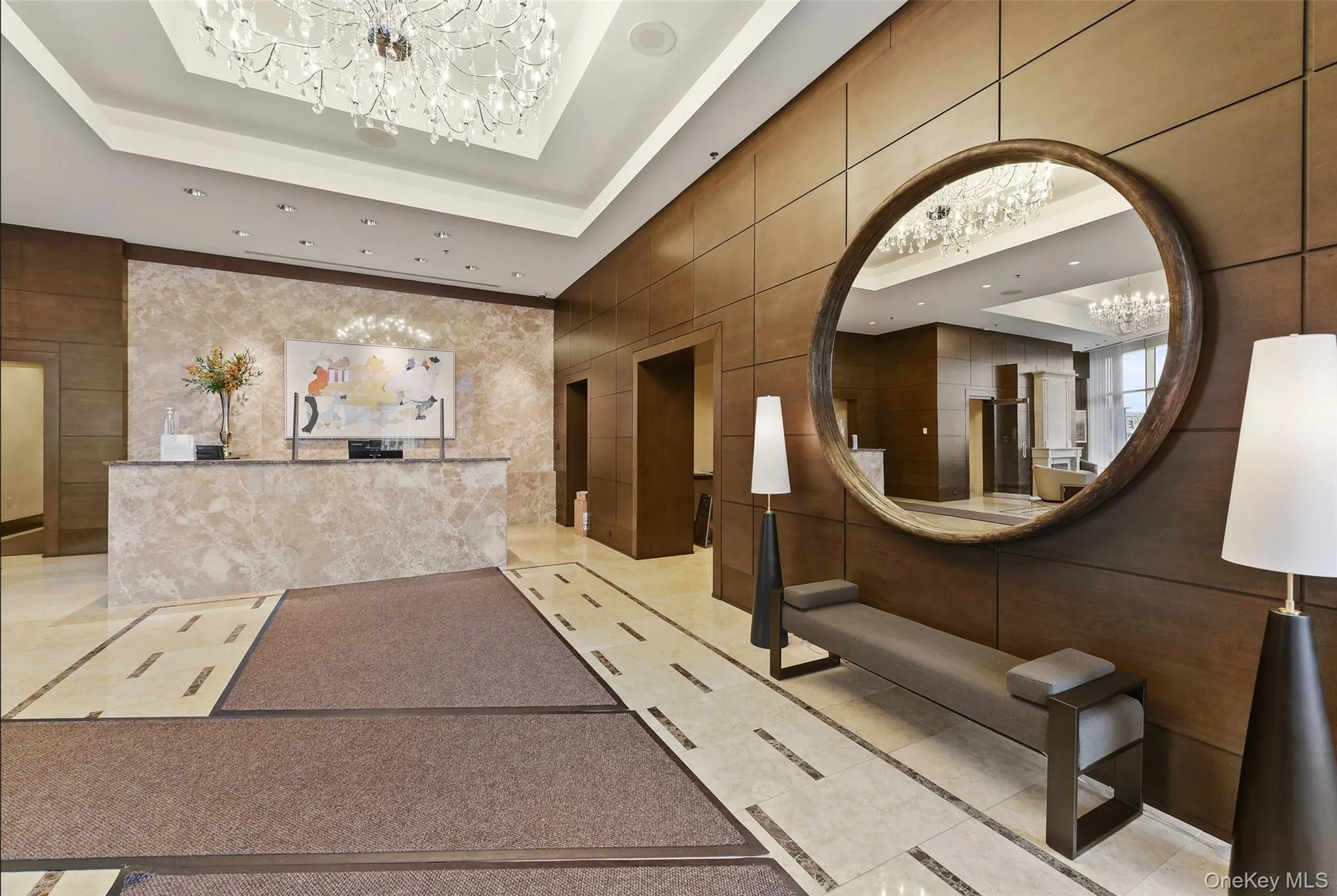 Reception area with a chandelier and recessed lighting Reception area with a chandelier and recessed lighting